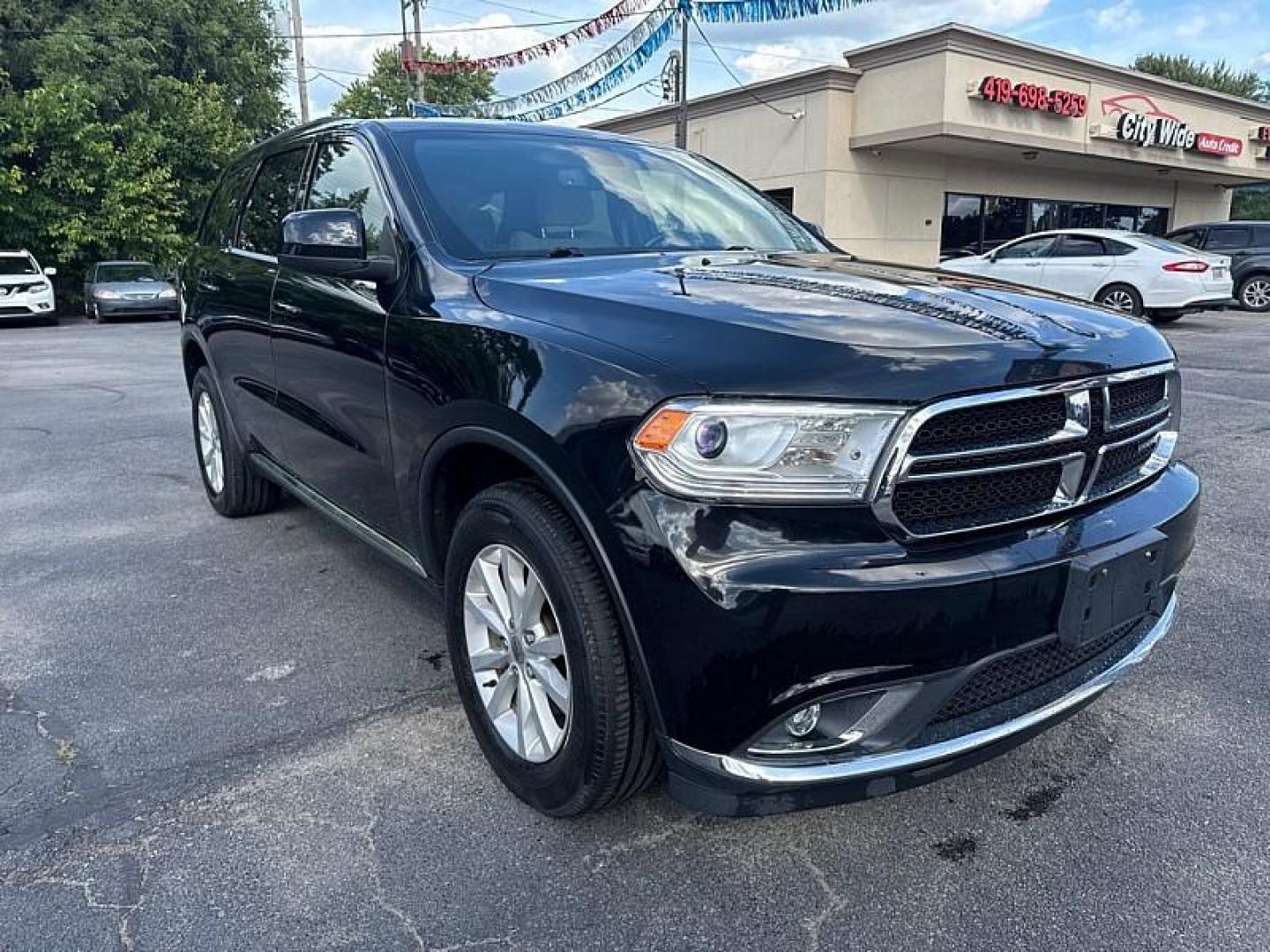 2020 BLACK /TAN Dodge Durango SXT AWD (1C4RDJAG8LC) with an 3.6L V6 DOHC 24V engine, 8A transmission, located at 3304 Woodville Road, Northwood, OH, 43619, (419) 210-8019, 41.612694, -83.480743 - Your #1 Destination for Auto Loans and mdash;No Matter Your Credit!At our dealership, we believe everyone deserves the opportunity to drive their dream car and mdash;whether you have good credit, bad credit, or no credit at all. With a wide selection of hundreds of cars, trucks, and SUVs, you'll fin - Photo#6