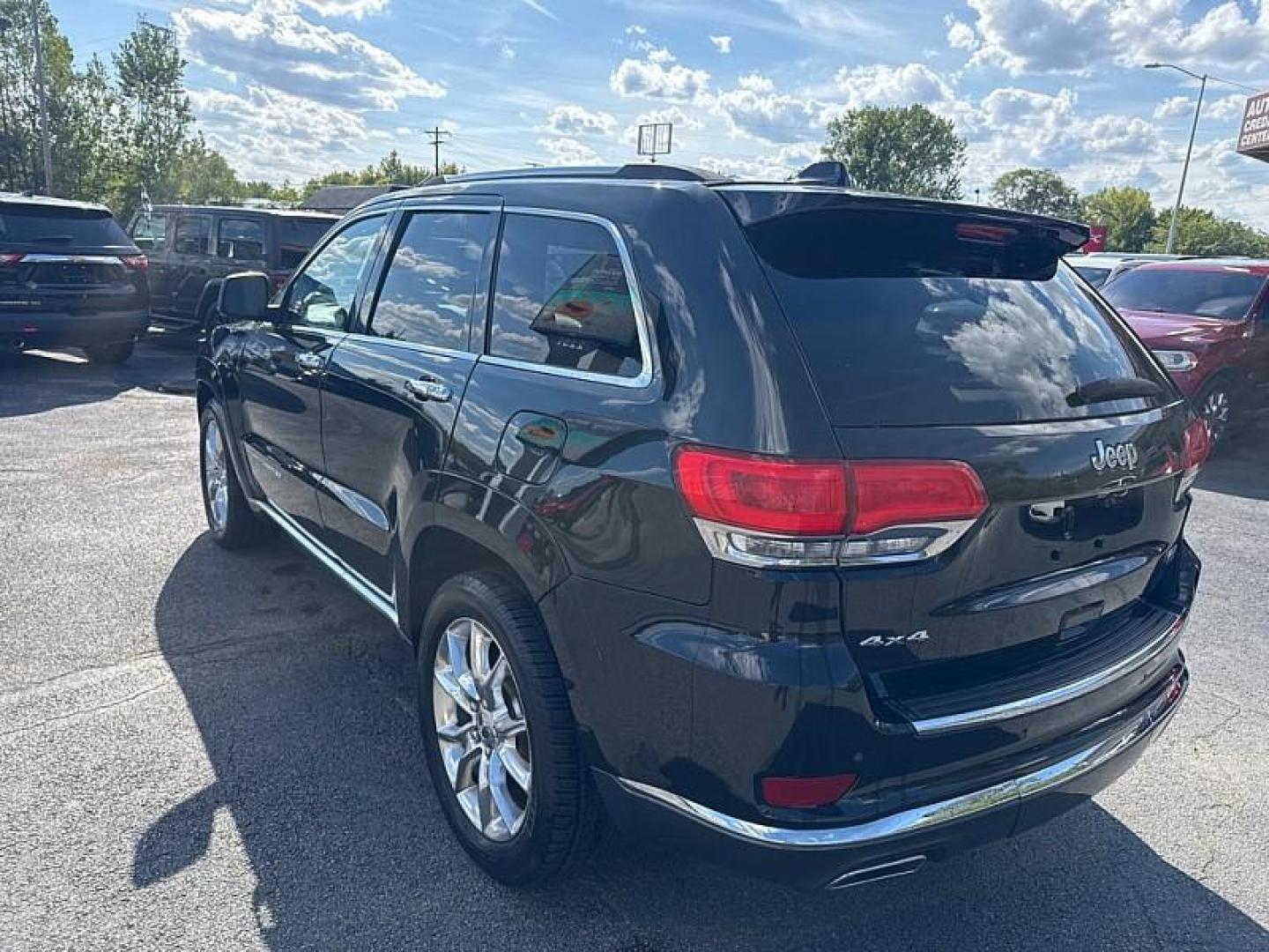 2014 BLACK /BROWN Jeep Grand Cherokee Summit 4WD (1C4RJFJG5EC) with an 3.6L V6 DOHC 24V engine, 5-Speed Automatic transmission, located at 3304 Woodville Road, Northwood, OH, 43619, (419) 210-8019, 41.612694, -83.480743 - Your #1 Destination for Auto Loans and mdash;No Matter Your Credit!At our dealership, we believe everyone deserves the opportunity to drive their dream car and mdash;whether you have good credit, bad credit, or no credit at all. With a wide selection of hundreds of cars, trucks, and SUVs, you'll fin - Photo#2