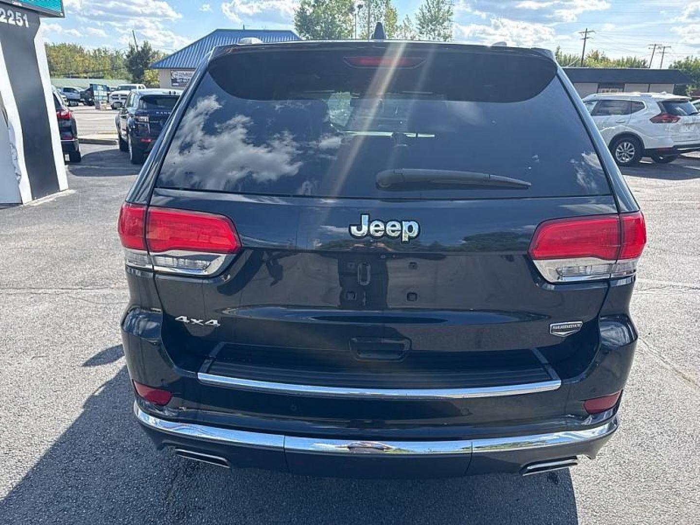 2014 BLACK /BROWN Jeep Grand Cherokee Summit 4WD (1C4RJFJG5EC) with an 3.6L V6 DOHC 24V engine, 5-Speed Automatic transmission, located at 3304 Woodville Road, Northwood, OH, 43619, (419) 210-8019, 41.612694, -83.480743 - Your #1 Destination for Auto Loans and mdash;No Matter Your Credit!At our dealership, we believe everyone deserves the opportunity to drive their dream car and mdash;whether you have good credit, bad credit, or no credit at all. With a wide selection of hundreds of cars, trucks, and SUVs, you'll fin - Photo#3