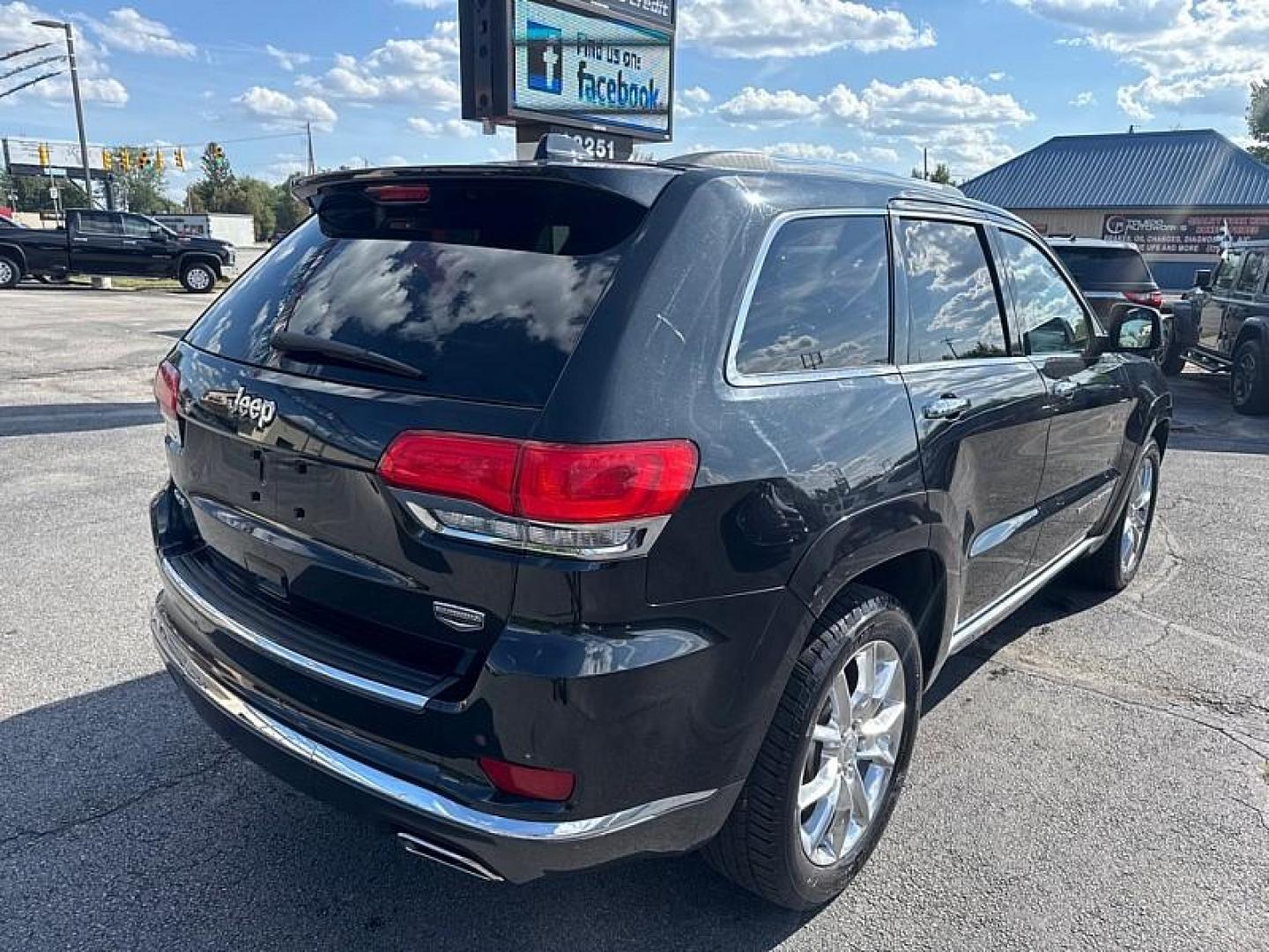 2014 BLACK /BROWN Jeep Grand Cherokee Summit 4WD (1C4RJFJG5EC) with an 3.6L V6 DOHC 24V engine, 5-Speed Automatic transmission, located at 3304 Woodville Road, Northwood, OH, 43619, (419) 210-8019, 41.612694, -83.480743 - Your #1 Destination for Auto Loans and mdash;No Matter Your Credit!At our dealership, we believe everyone deserves the opportunity to drive their dream car and mdash;whether you have good credit, bad credit, or no credit at all. With a wide selection of hundreds of cars, trucks, and SUVs, you'll fin - Photo#4