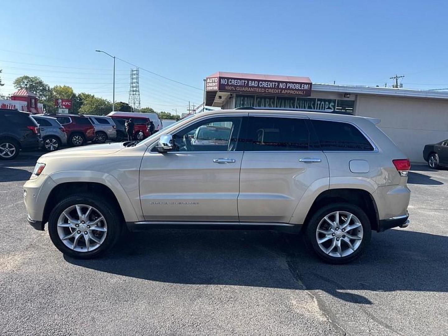 2014 GOLD /BLACK Jeep Grand Cherokee Summit 4WD (1C4RJFJG8EC) with an 3.6L V6 DOHC 24V engine, 5-Speed Automatic transmission, located at 3304 Woodville Road, Northwood, OH, 43619, (419) 210-8019, 41.612694, -83.480743 - Your #1 Destination for Auto Loans and mdash;No Matter Your Credit!At our dealership, we believe everyone deserves the opportunity to drive their dream car and mdash;whether you have good credit, bad credit, or no credit at all. With a wide selection of hundreds of cars, trucks, and SUVs, you'll fin - Photo#1