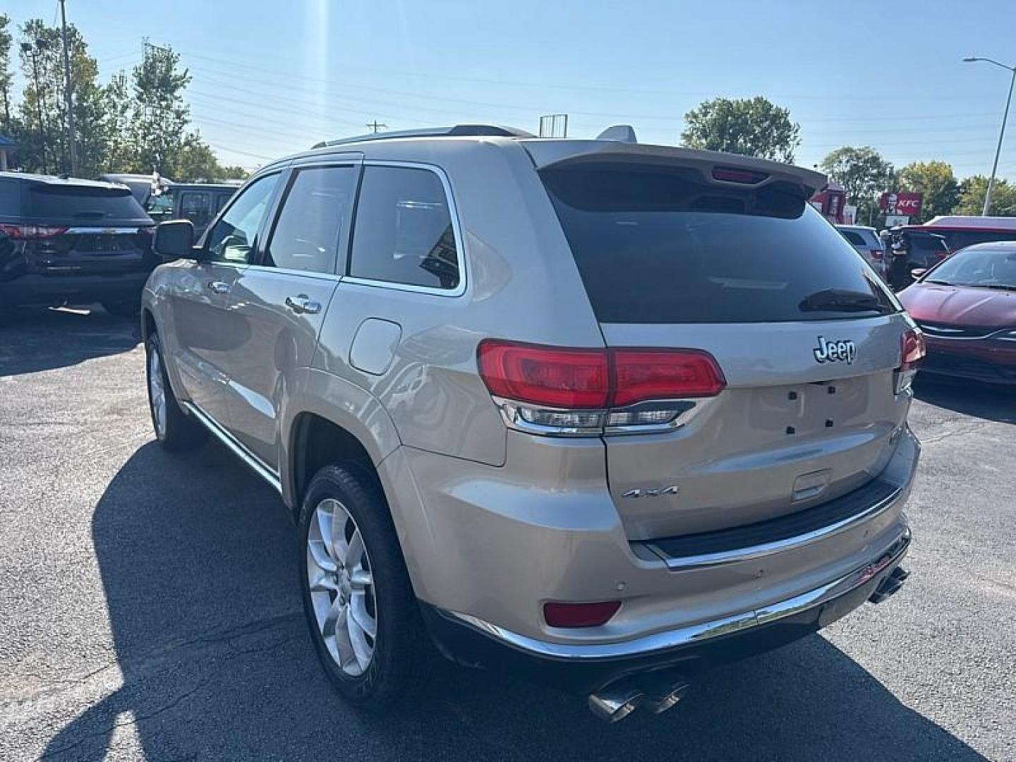 2014 GOLD /BLACK Jeep Grand Cherokee Summit 4WD (1C4RJFJG8EC) with an 3.6L V6 DOHC 24V engine, 5-Speed Automatic transmission, located at 3304 Woodville Road, Northwood, OH, 43619, (419) 210-8019, 41.612694, -83.480743 - Your #1 Destination for Auto Loans and mdash;No Matter Your Credit!At our dealership, we believe everyone deserves the opportunity to drive their dream car and mdash;whether you have good credit, bad credit, or no credit at all. With a wide selection of hundreds of cars, trucks, and SUVs, you'll fin - Photo#2