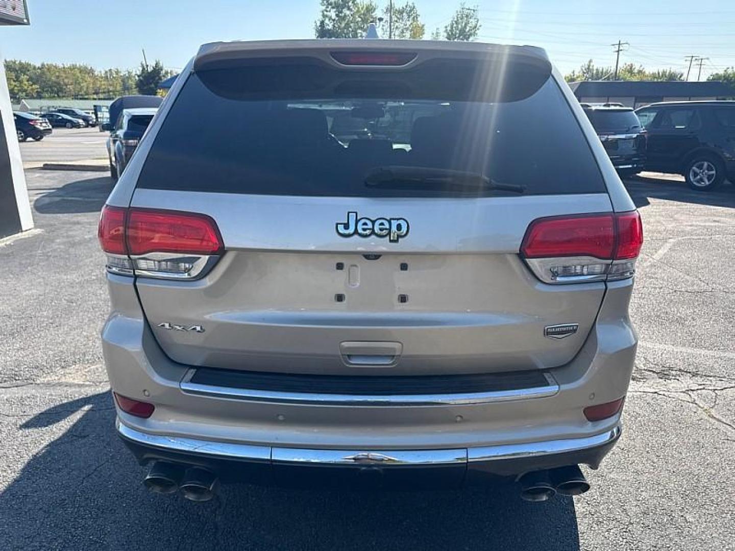 2014 GOLD /BLACK Jeep Grand Cherokee Summit 4WD (1C4RJFJG8EC) with an 3.6L V6 DOHC 24V engine, 5-Speed Automatic transmission, located at 3304 Woodville Road, Northwood, OH, 43619, (419) 210-8019, 41.612694, -83.480743 - Your #1 Destination for Auto Loans and mdash;No Matter Your Credit!At our dealership, we believe everyone deserves the opportunity to drive their dream car and mdash;whether you have good credit, bad credit, or no credit at all. With a wide selection of hundreds of cars, trucks, and SUVs, you'll fin - Photo#3