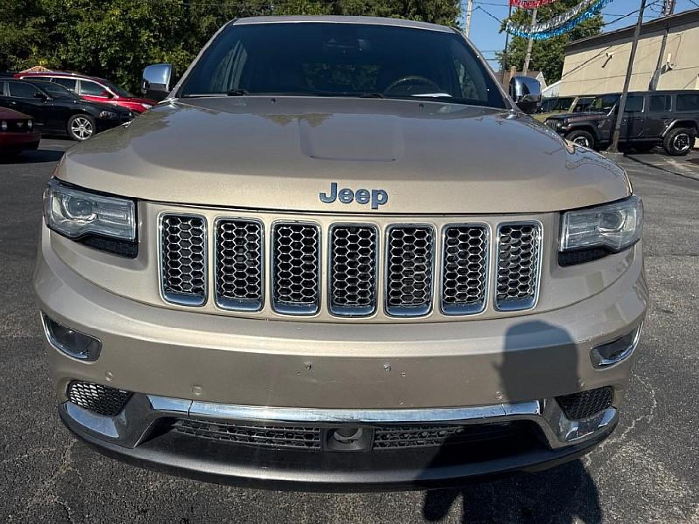 2014 GOLD /BLACK Jeep Grand Cherokee Summit 4WD (1C4RJFJG8EC) with an 3.6L V6 DOHC 24V engine, 5-Speed Automatic transmission, located at 3304 Woodville Road, Northwood, OH, 43619, (419) 210-8019, 41.612694, -83.480743 - Your #1 Destination for Auto Loans and mdash;No Matter Your Credit!At our dealership, we believe everyone deserves the opportunity to drive their dream car and mdash;whether you have good credit, bad credit, or no credit at all. With a wide selection of hundreds of cars, trucks, and SUVs, you'll fin - Photo#7