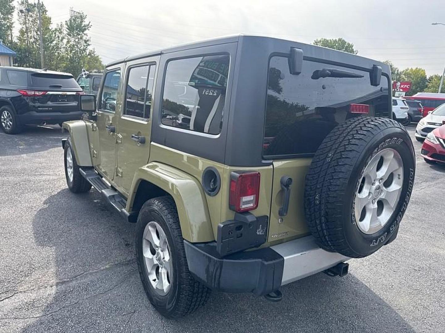 2013 GREEN /BLACK Jeep Wrangler Unlimited Sahara 4WD (1C4BJWEG0DL) with an 3.6L V6 DOHC 24V FFV engine, Automatic 5-Spd transmission, located at 3304 Woodville Road, Northwood, OH, 43619, (419) 210-8019, 41.612694, -83.480743 - Your #1 Destination for Auto Loans and mdash;No Matter Your Credit!At our dealership, we believe everyone deserves the opportunity to drive their dream car and mdash;whether you have good credit, bad credit, or no credit at all. With a wide selection of hundreds of cars, trucks, and SUVs, you'll fin - Photo#2