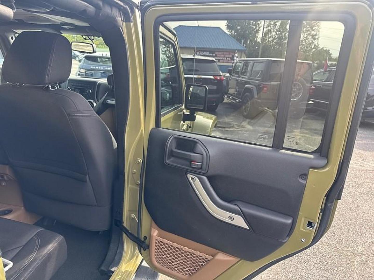 2013 GREEN /BLACK Jeep Wrangler Unlimited Sahara 4WD (1C4BJWEG0DL) with an 3.6L V6 DOHC 24V FFV engine, Automatic 5-Spd transmission, located at 3304 Woodville Road, Northwood, OH, 43619, (419) 210-8019, 41.612694, -83.480743 - Your #1 Destination for Auto Loans and mdash;No Matter Your Credit!At our dealership, we believe everyone deserves the opportunity to drive their dream car and mdash;whether you have good credit, bad credit, or no credit at all. With a wide selection of hundreds of cars, trucks, and SUVs, you'll fin - Photo#13