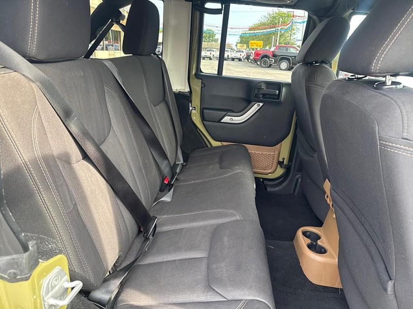 2013 GREEN /BLACK Jeep Wrangler Unlimited Sahara 4WD (1C4BJWEG0DL) with an 3.6L V6 DOHC 24V FFV engine, Automatic 5-Spd transmission, located at 3304 Woodville Road, Northwood, OH, 43619, (419) 210-8019, 41.612694, -83.480743 - Your #1 Destination for Auto Loans and mdash;No Matter Your Credit!At our dealership, we believe everyone deserves the opportunity to drive their dream car and mdash;whether you have good credit, bad credit, or no credit at all. With a wide selection of hundreds of cars, trucks, and SUVs, you'll fin - Photo#14