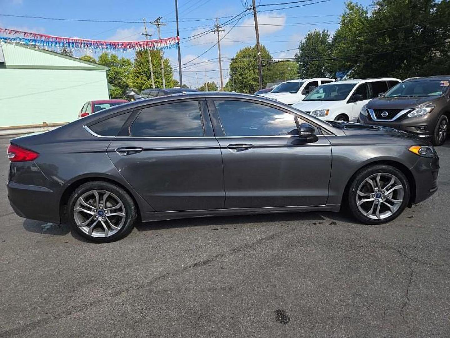 2020 GRAY /BLACK Ford Fusion SEL (3FA6P0CD9LR) with an 1.5L L4 DOHC 16V engine, 6A transmission, located at 3304 Woodville Road, Northwood, OH, 43619, (419) 210-8019, 41.612694, -83.480743 - Your #1 Destination for Auto Loans and mdash;No Matter Your Credit!At our dealership, we believe everyone deserves the opportunity to drive their dream car and mdash;whether you have good credit, bad credit, or no credit at all. With a wide selection of hundreds of cars, trucks, and SUVs, you'll fin - Photo#5