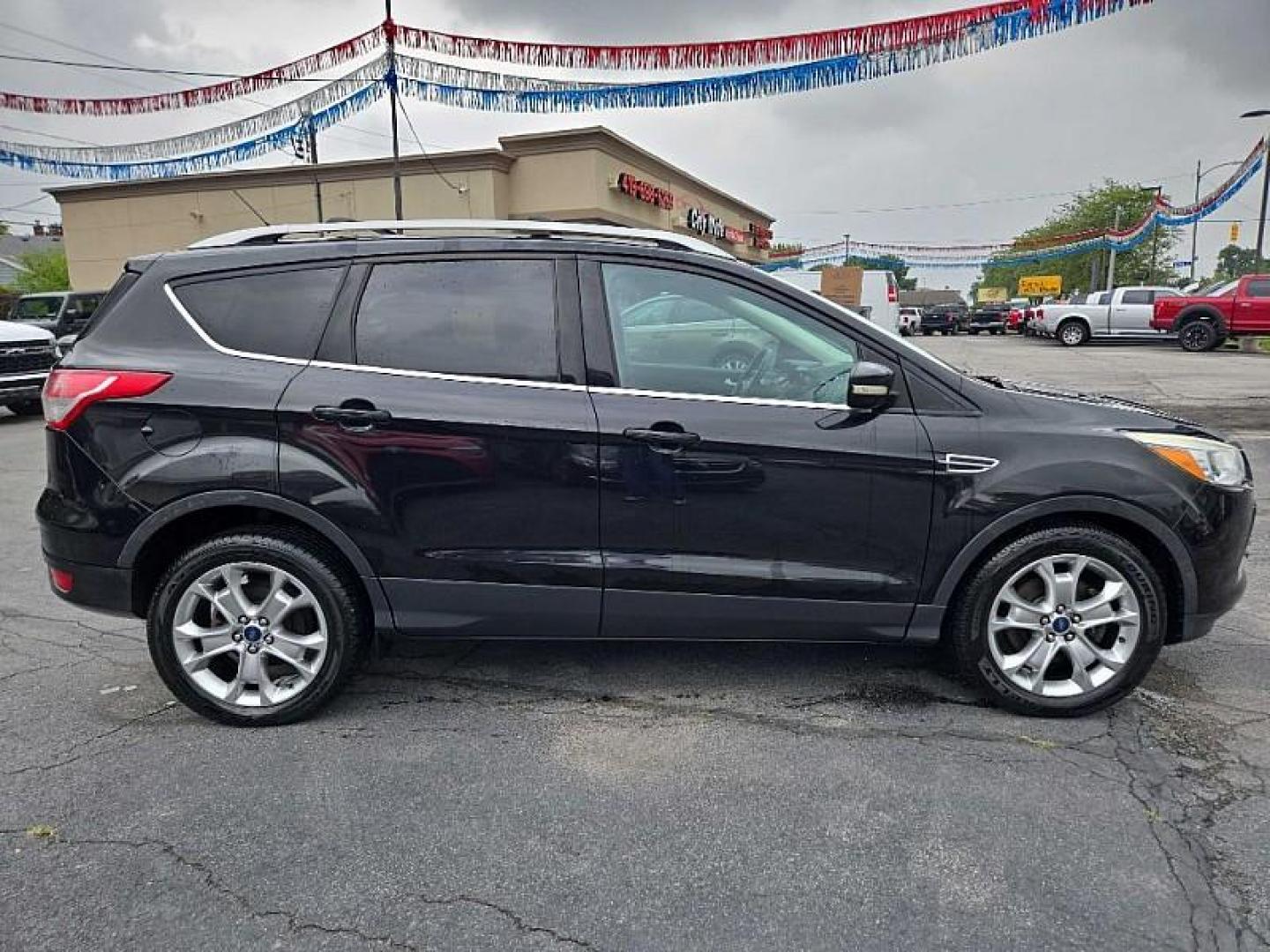 2014 BLACK /BLACK Ford Escape Titanium FWD (1FMCU0J9XEU) with an 2.0L L4 DOHC 16V engine, 6-Speed Automatic transmission, located at 3304 Woodville Road, Northwood, OH, 43619, (419) 210-8019, 41.612694, -83.480743 - Your #1 Destination for Auto Loans and mdash;No Matter Your Credit!At our dealership, we believe everyone deserves the opportunity to drive their dream car and mdash;whether you have good credit, bad credit, or no credit at all. With a wide selection of hundreds of cars, trucks, and SUVs, you'll fin - Photo#5