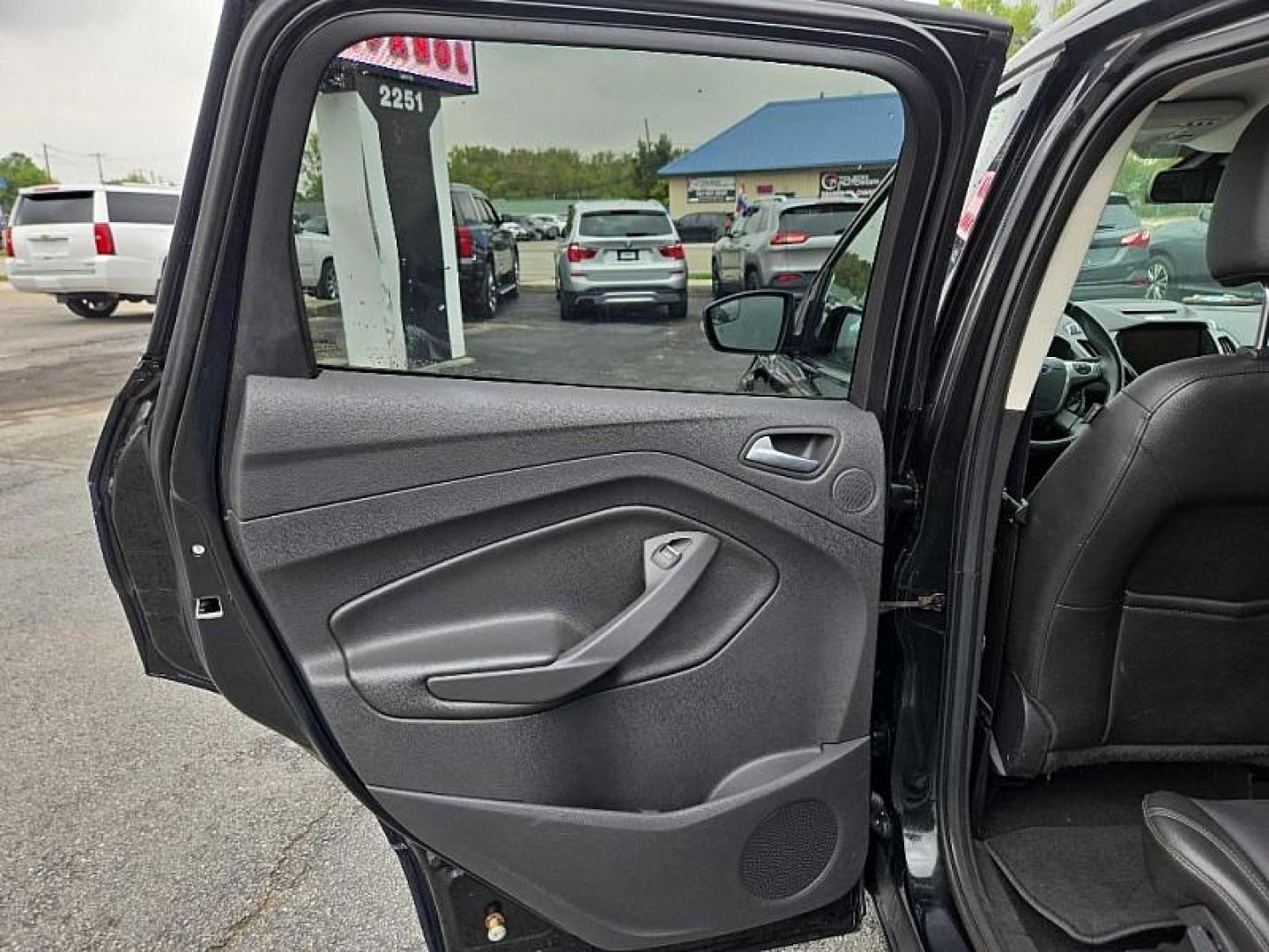 2014 BLACK /BLACK Ford Escape Titanium FWD (1FMCU0J9XEU) with an 2.0L L4 DOHC 16V engine, 6-Speed Automatic transmission, located at 3304 Woodville Road, Northwood, OH, 43619, (419) 210-8019, 41.612694, -83.480743 - Your #1 Destination for Auto Loans and mdash;No Matter Your Credit!At our dealership, we believe everyone deserves the opportunity to drive their dream car and mdash;whether you have good credit, bad credit, or no credit at all. With a wide selection of hundreds of cars, trucks, and SUVs, you'll fin - Photo#10