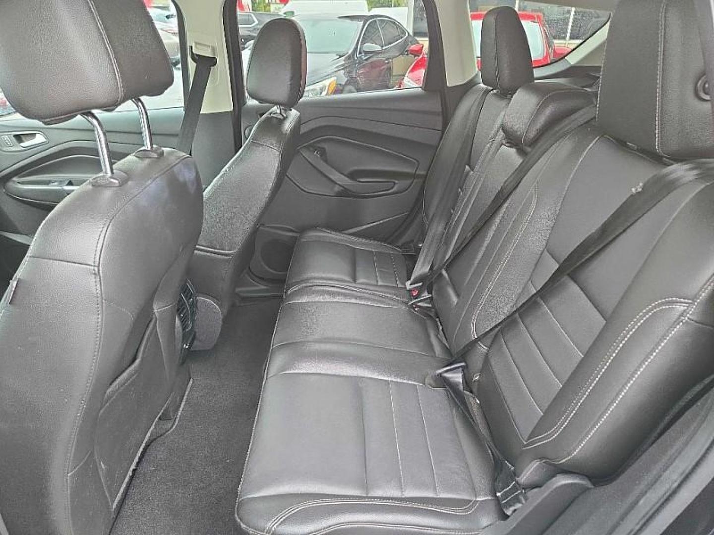 2014 BLACK /BLACK Ford Escape Titanium FWD (1FMCU0J9XEU) with an 2.0L L4 DOHC 16V engine, 6-Speed Automatic transmission, located at 3304 Woodville Road, Northwood, OH, 43619, (419) 210-8019, 41.612694, -83.480743 - Your #1 Destination for Auto Loans and mdash;No Matter Your Credit!At our dealership, we believe everyone deserves the opportunity to drive their dream car and mdash;whether you have good credit, bad credit, or no credit at all. With a wide selection of hundreds of cars, trucks, and SUVs, you'll fin - Photo#11