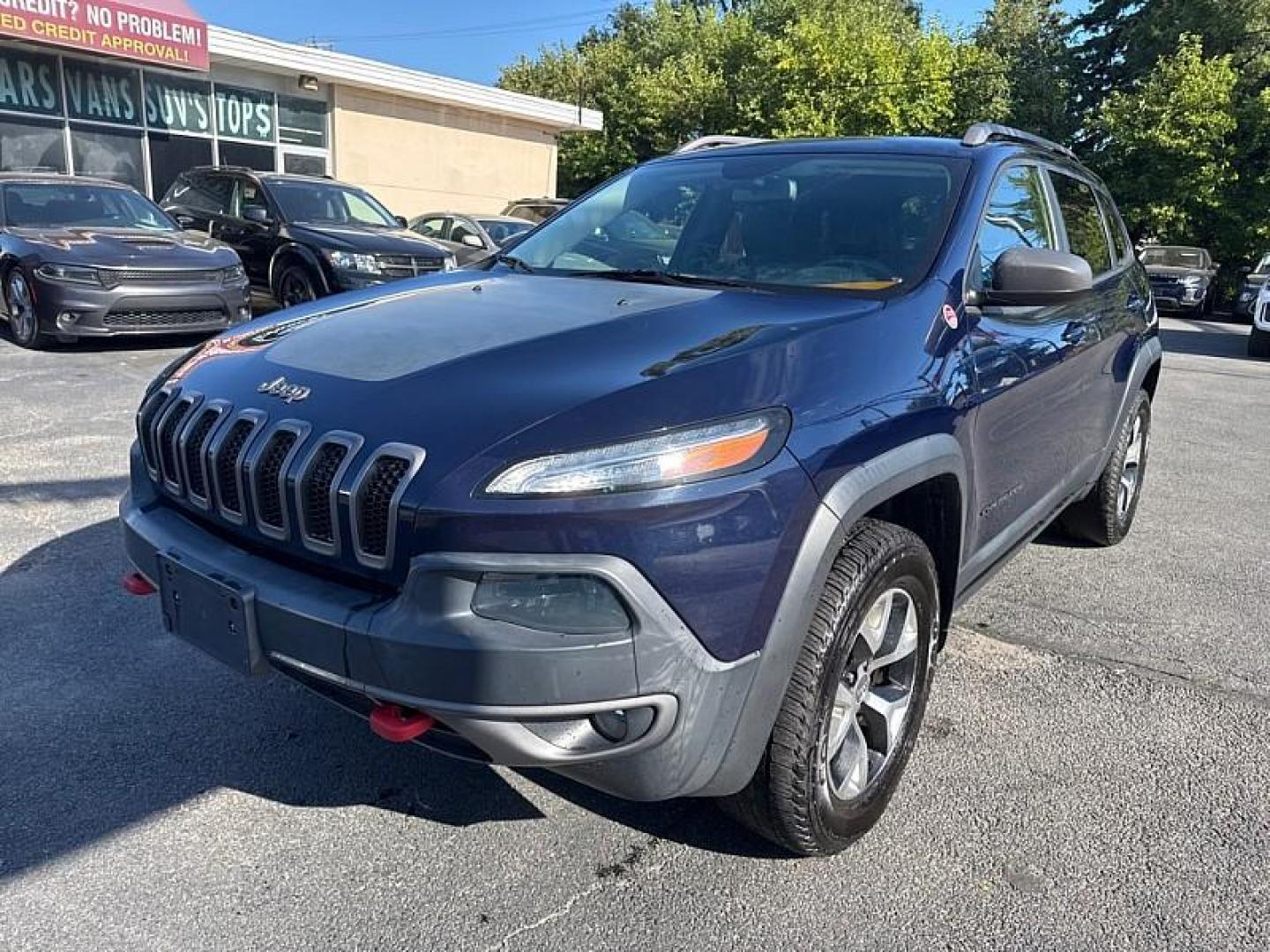2015 BLUE /BLACK Jeep Cherokee Trailhawk 4WD (1C4PJMBB5FW) with an 2.4L L4 DOHC 16V engine, 9-Speed Automatic transmission, located at 3304 Woodville Road, Northwood, OH, 43619, (419) 210-8019, 41.612694, -83.480743 - Your #1 Destination for Auto Loans and mdash;No Matter Your Credit!At our dealership, we believe everyone deserves the opportunity to drive their dream car and mdash;whether you have good credit, bad credit, or no credit at all. With a wide selection of hundreds of cars, trucks, and SUVs, you'll fin - Photo#0