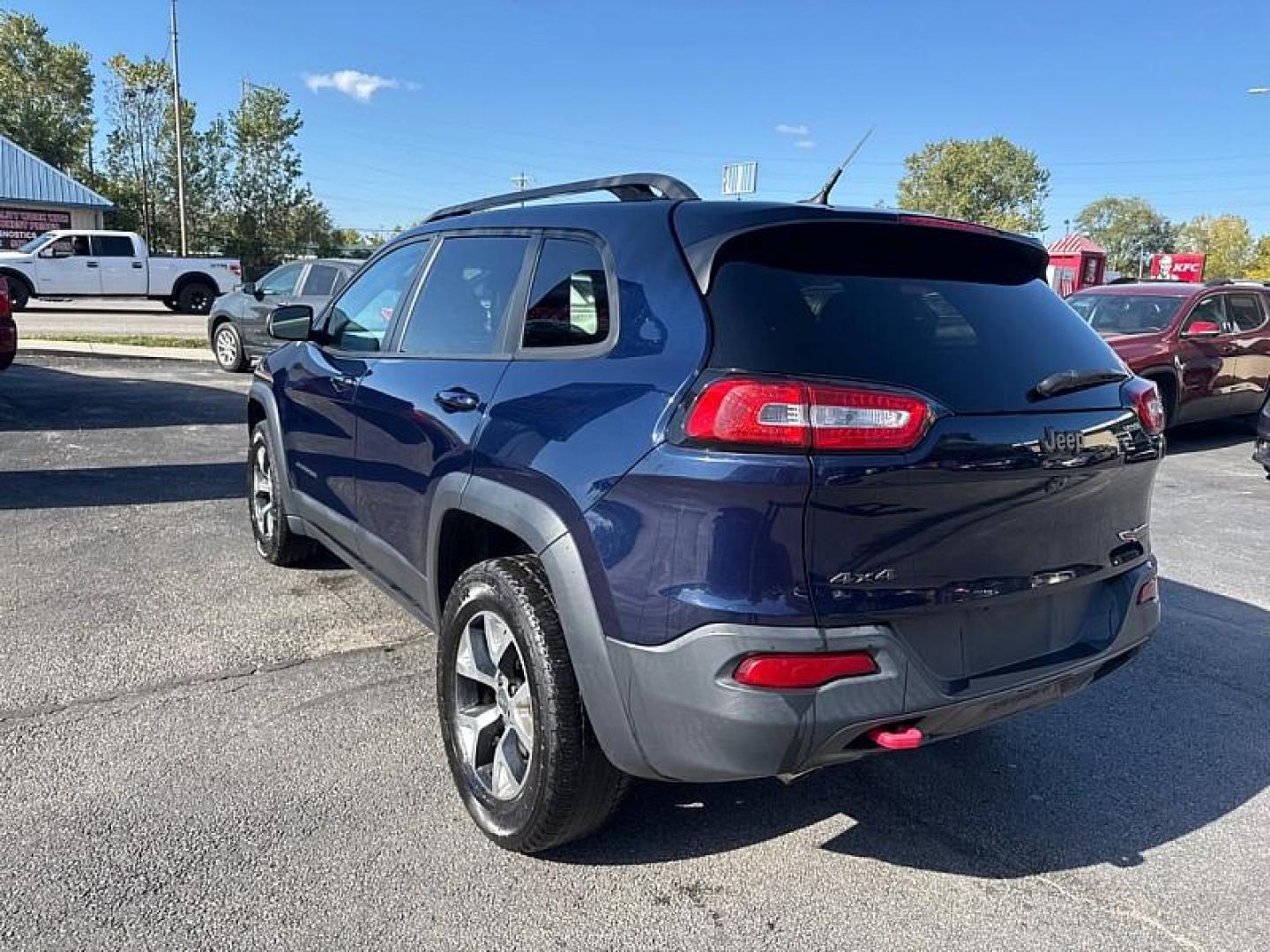 2015 BLUE /BLACK Jeep Cherokee Trailhawk 4WD (1C4PJMBB5FW) with an 2.4L L4 DOHC 16V engine, 9-Speed Automatic transmission, located at 3304 Woodville Road, Northwood, OH, 43619, (419) 210-8019, 41.612694, -83.480743 - Your #1 Destination for Auto Loans and mdash;No Matter Your Credit!At our dealership, we believe everyone deserves the opportunity to drive their dream car and mdash;whether you have good credit, bad credit, or no credit at all. With a wide selection of hundreds of cars, trucks, and SUVs, you'll fin - Photo#2