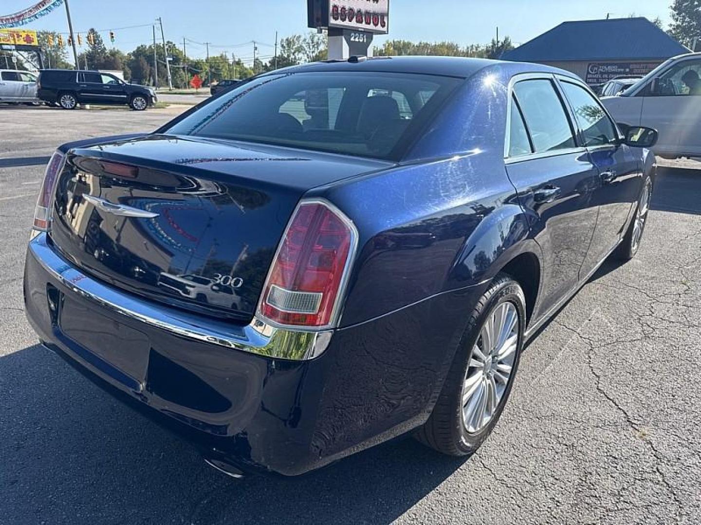 2014 BLUE /BLACK Chrysler 300 AWD (2C3CCARG8EH) with an 3.6L V6 SOHC 24V engine, 8-Speed Automatic transmission, located at 3304 Woodville Road, Northwood, OH, 43619, (419) 210-8019, 41.612694, -83.480743 - Your #1 Destination for Auto Loans and mdash;No Matter Your Credit!At our dealership, we believe everyone deserves the opportunity to drive their dream car and mdash;whether you have good credit, bad credit, or no credit at all. With a wide selection of hundreds of cars, trucks, and SUVs, you'll fin - Photo#4