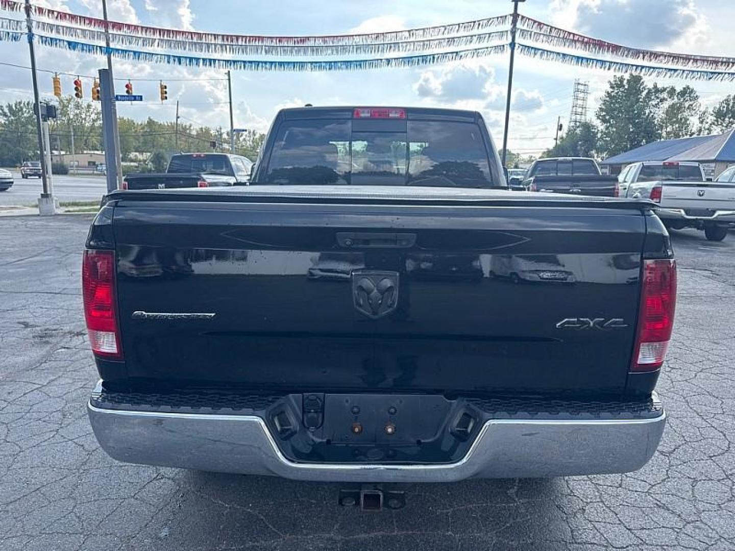 2014 BLACK /BLACK/GRAY RAM 1500 SLT Quad Cab 4WD (1C6RR7GT3ES) with an 5.7L V8 OHV 16V engine, 6-Speed Automatic transmission, located at 3304 Woodville Road, Northwood, OH, 43619, (419) 210-8019, 41.612694, -83.480743 - Your #1 Destination for Auto Loans and mdash;No Matter Your Credit!At our dealership, we believe everyone deserves the opportunity to drive their dream car and mdash;whether you have good credit, bad credit, or no credit at all. With a wide selection of hundreds of cars, trucks, and SUVs, you'll fin - Photo#3