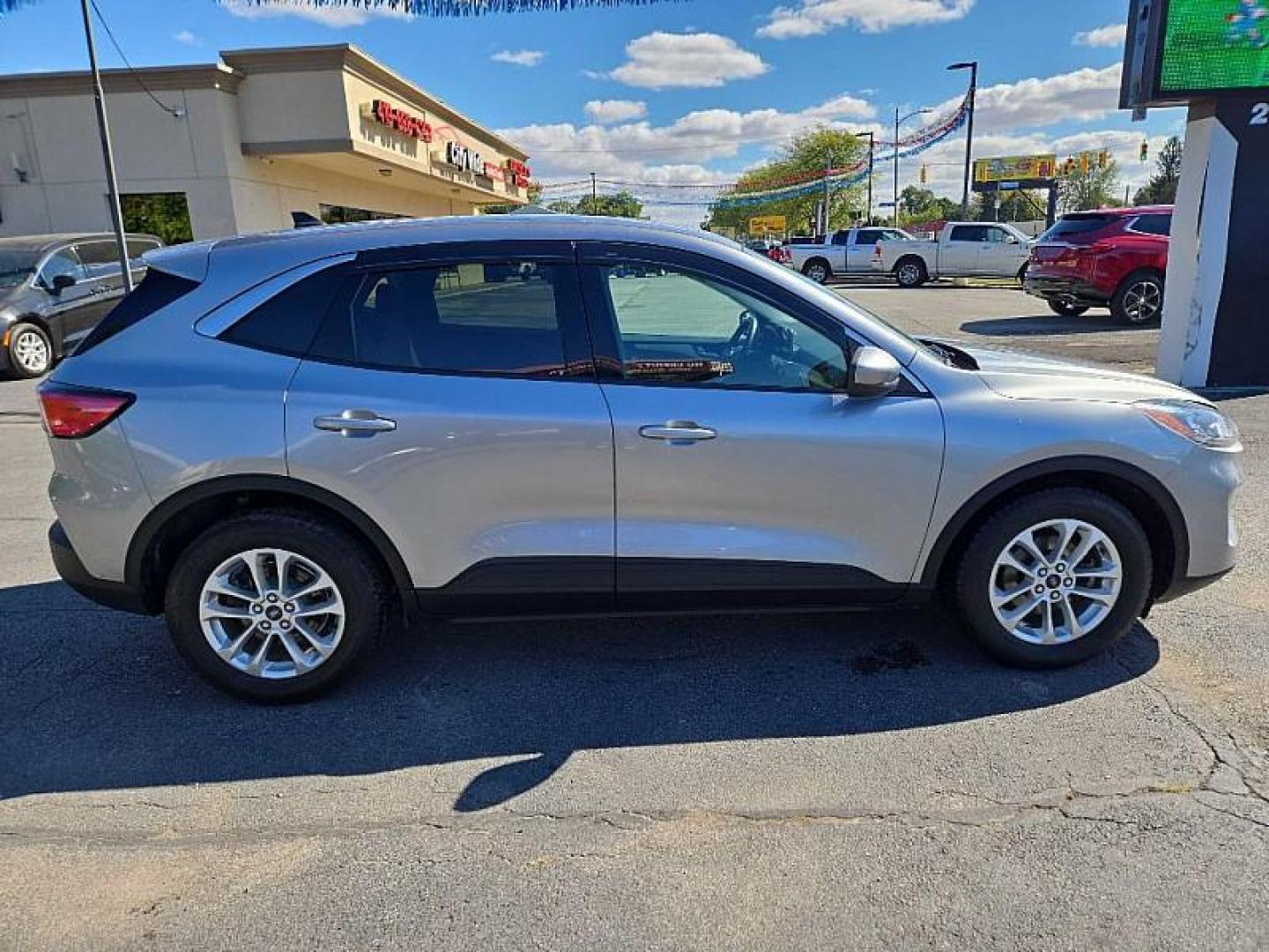 2021 SILVER /BLACK Ford Escape SE (1FMCU0G63MU) with an 1.5L L3 engine, 6A transmission, located at 3304 Woodville Road, Northwood, OH, 43619, (419) 210-8019, 41.612694, -83.480743 - Your #1 Destination for Auto Loans and mdash;No Matter Your Credit!At our dealership, we believe everyone deserves the opportunity to drive their dream car and mdash;whether you have good credit, bad credit, or no credit at all. With a wide selection of hundreds of cars, trucks, and SUVs, you'll fin - Photo#5