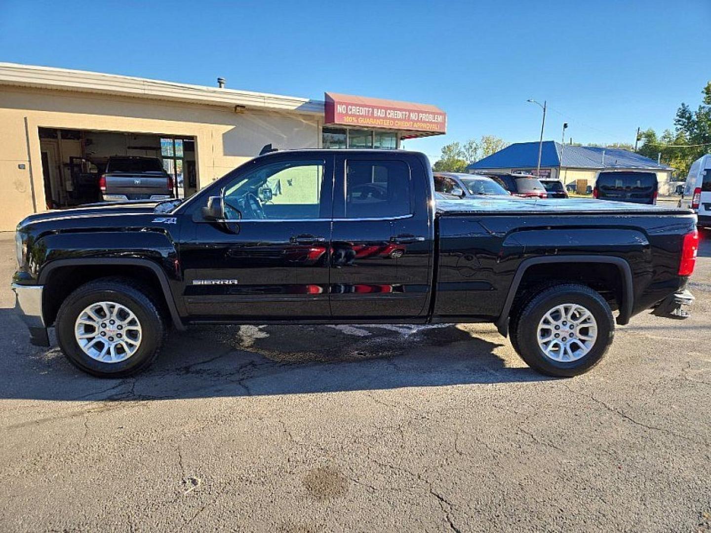 2019 BLACK /BLACK GMC Sierra 1500 SLE Double Cab 4WD (2GTV2MECXK1) with an 5.3L V8 OHV 16V engine, 6A transmission, located at 3304 Woodville Road, Northwood, OH, 43619, (419) 210-8019, 41.612694, -83.480743 - Your #1 Destination for Auto Loans and mdash;No Matter Your Credit!At our dealership, we believe everyone deserves the opportunity to drive their dream car and mdash;whether you have good credit, bad credit, or no credit at all. With a wide selection of hundreds of cars, trucks, and SUVs, you'll fin- Photo#2