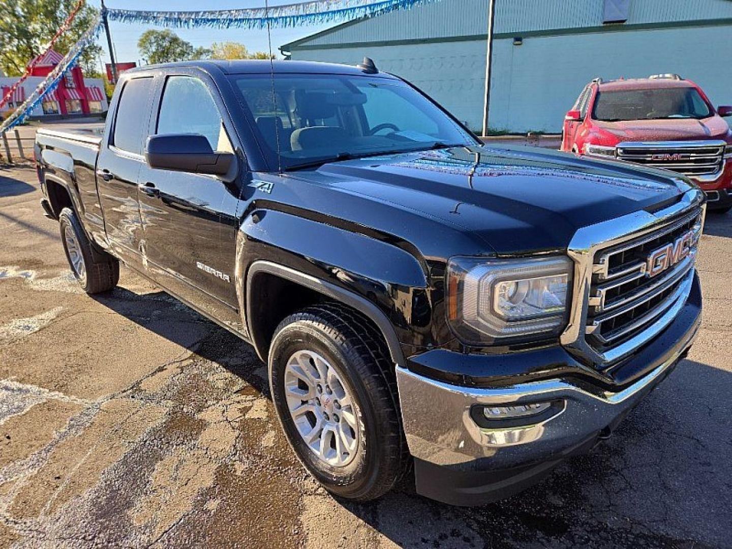 2019 BLACK /BLACK GMC Sierra 1500 SLE Double Cab 4WD (2GTV2MECXK1) with an 5.3L V8 OHV 16V engine, 6A transmission, located at 3304 Woodville Road, Northwood, OH, 43619, (419) 210-8019, 41.612694, -83.480743 - Your #1 Destination for Auto Loans and mdash;No Matter Your Credit!At our dealership, we believe everyone deserves the opportunity to drive their dream car and mdash;whether you have good credit, bad credit, or no credit at all. With a wide selection of hundreds of cars, trucks, and SUVs, you'll fin- Photo#5