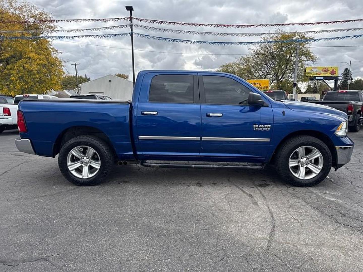 2014 BLUE /BLACK RAM 1500 SLT Crew Cab SWB 2WD (1C6RR6LG5ES) with an 3.6L V6 DOHC 24V FFV engine, 6-Speed Automatic transmission, located at 3304 Woodville Road, Northwood, OH, 43619, (419) 210-8019, 41.612694, -83.480743 - Your #1 Destination for Auto Loans and mdash;No Matter Your Credit!At our dealership, we believe everyone deserves the opportunity to drive their dream car and mdash;whether you have good credit, bad credit, or no credit at all. With a wide selection of hundreds of cars, trucks, and SUVs, you'll fin - Photo#5