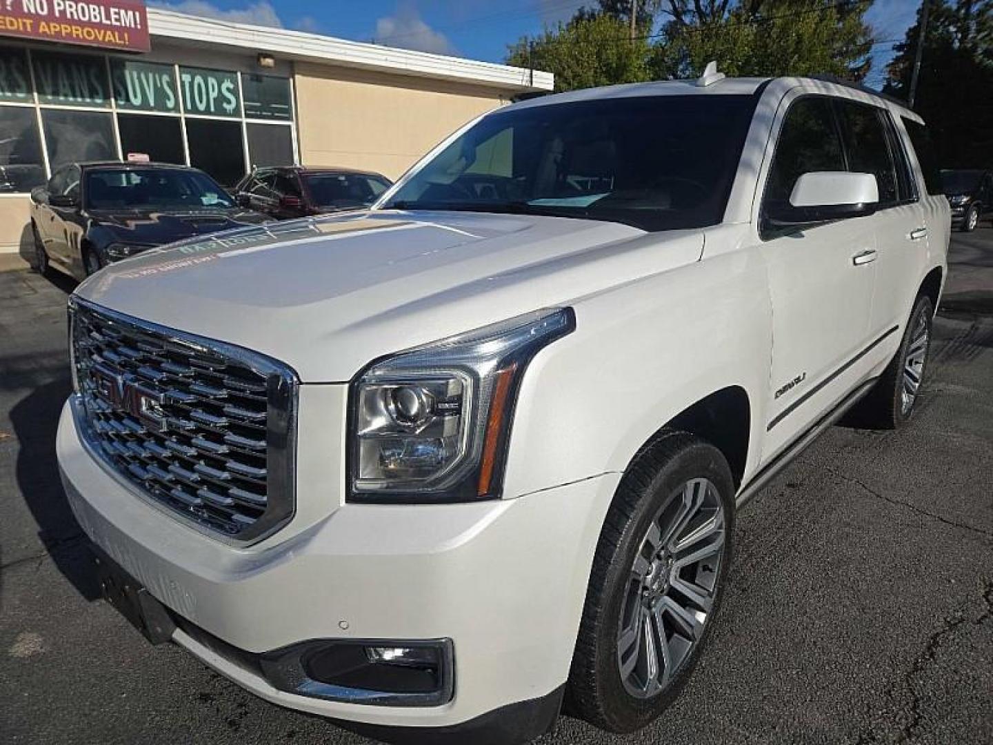 2018 WHITE /BEIGE GMC Yukon Denali 4WD (1GKS2CKJXJR) with an 6.2L V8 OHV 16V engine, 10A transmission, located at 3304 Woodville Road, Northwood, OH, 43619, (419) 210-8019, 41.612694, -83.480743 - Your #1 Destination for Auto Loans and mdash;No Matter Your Credit!At our dealership, we believe everyone deserves the opportunity to drive their dream car and mdash;whether you have good credit, bad credit, or no credit at all. With a wide selection of hundreds of cars, trucks, and SUVs, you'll fin - Photo#0