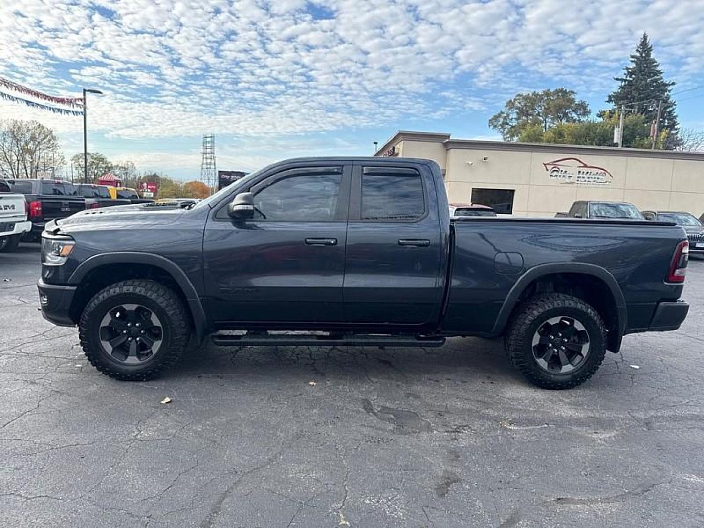 2019 GRAY /BLACK RAM 1500 Rebel Quad Cab 4WD (1C6SRFET0KN) with an 3.6L V6 FFV engine, 8A transmission, located at 3304 Woodville Road, Northwood, OH, 43619, (419) 210-8019, 41.612694, -83.480743 - Your #1 Destination for Auto Loans and mdash;No Matter Your Credit!At our dealership, we believe everyone deserves the opportunity to drive their dream car and mdash;whether you have good credit, bad credit, or no credit at all. With a wide selection of hundreds of cars, trucks, and SUVs, you'll fin - Photo#1