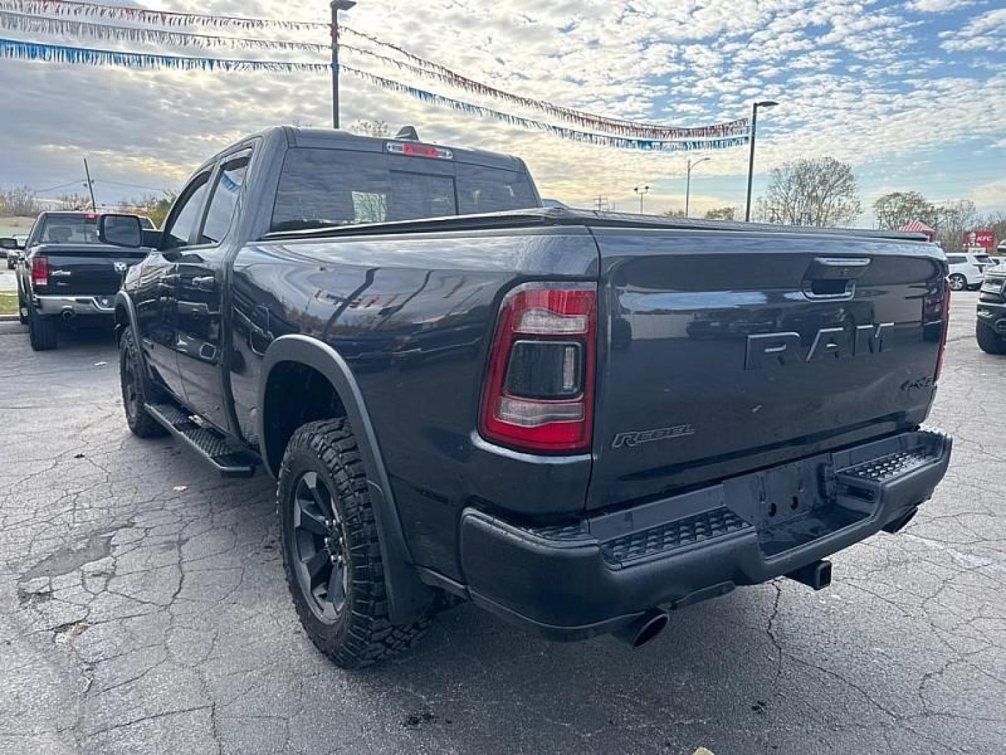 2019 GRAY /BLACK RAM 1500 Rebel Quad Cab 4WD (1C6SRFET0KN) with an 3.6L V6 FFV engine, 8A transmission, located at 3304 Woodville Road, Northwood, OH, 43619, (419) 210-8019, 41.612694, -83.480743 - Your #1 Destination for Auto Loans and mdash;No Matter Your Credit!At our dealership, we believe everyone deserves the opportunity to drive their dream car and mdash;whether you have good credit, bad credit, or no credit at all. With a wide selection of hundreds of cars, trucks, and SUVs, you'll fin - Photo#2