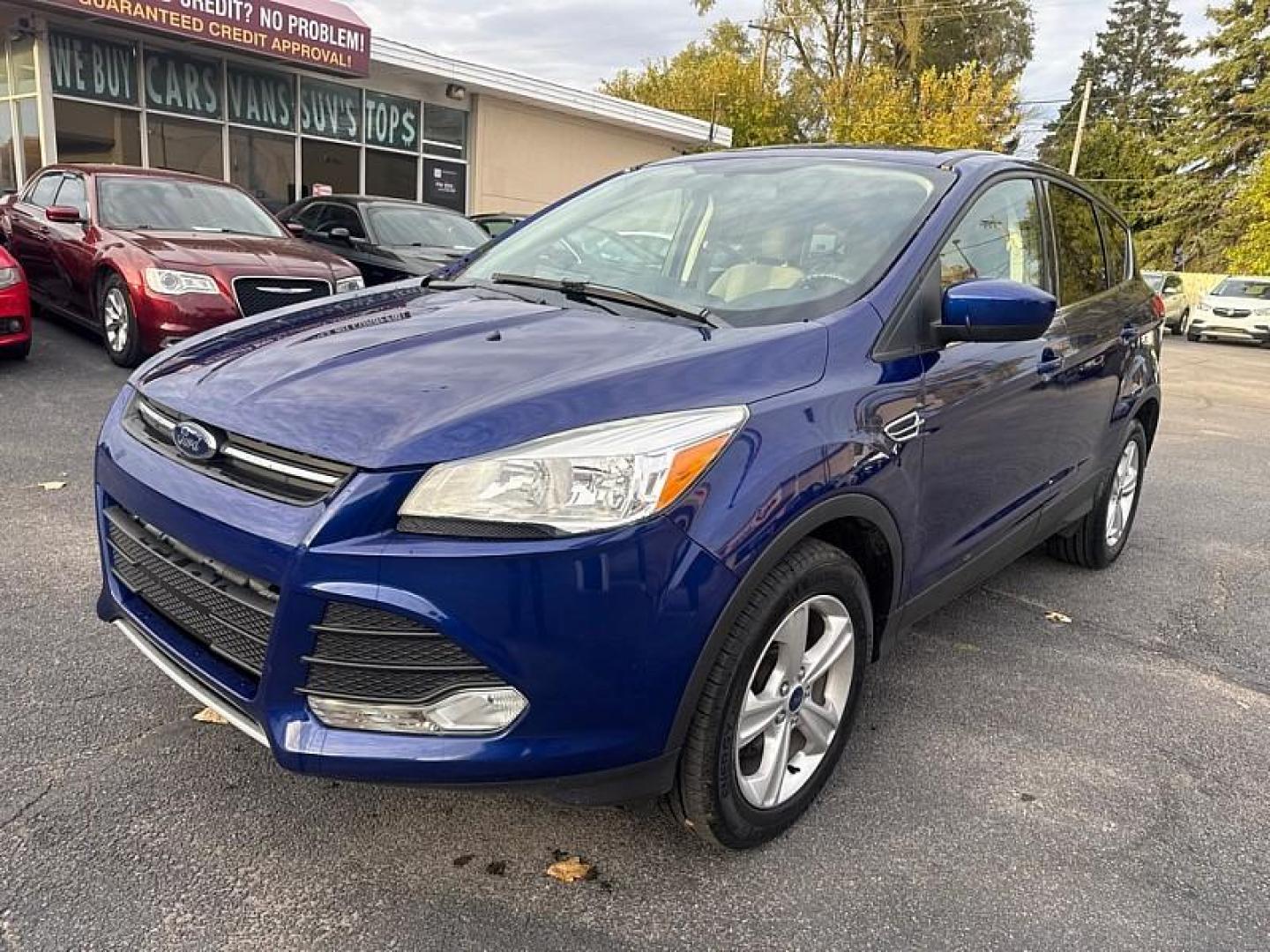 2016 BLUE /GRAY Ford Escape SE 4WD (1FMCU9GX0GU) with an 1.6L L4 DOHC 16V engine, 6-Speed Automatic transmission, located at 3304 Woodville Road, Northwood, OH, 43619, (419) 210-8019, 41.612694, -83.480743 - Your #1 Destination for Auto Loans and mdash;No Matter Your Credit!At our dealership, we believe everyone deserves the opportunity to drive their dream car and mdash;whether you have good credit, bad credit, or no credit at all. With a wide selection of hundreds of cars, trucks, and SUVs, you'll fin - Photo#8