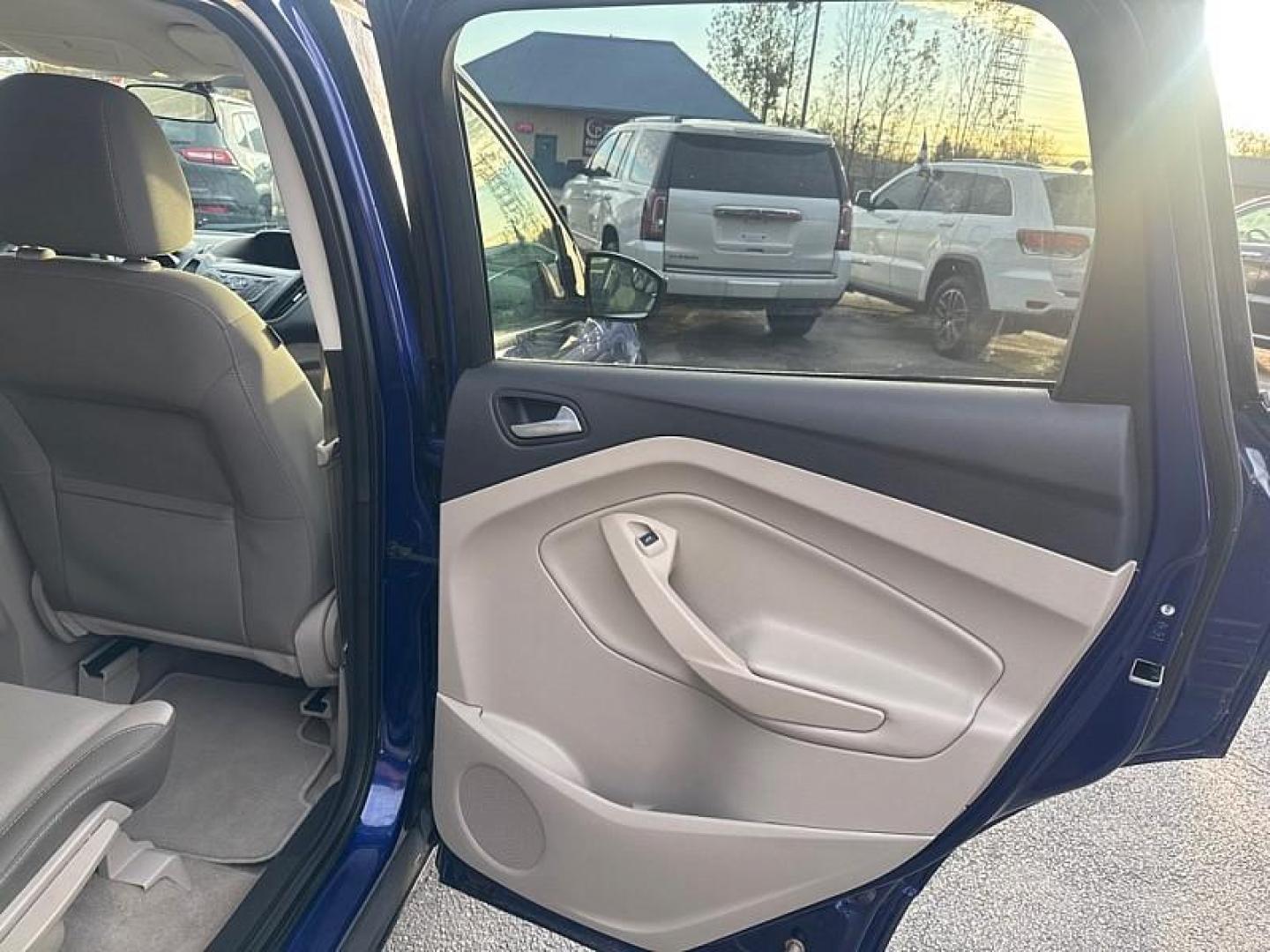 2016 BLUE /GRAY Ford Escape SE 4WD (1FMCU9GX0GU) with an 1.6L L4 DOHC 16V engine, 6-Speed Automatic transmission, located at 3304 Woodville Road, Northwood, OH, 43619, (419) 210-8019, 41.612694, -83.480743 - Your #1 Destination for Auto Loans and mdash;No Matter Your Credit!At our dealership, we believe everyone deserves the opportunity to drive their dream car and mdash;whether you have good credit, bad credit, or no credit at all. With a wide selection of hundreds of cars, trucks, and SUVs, you'll fin - Photo#14