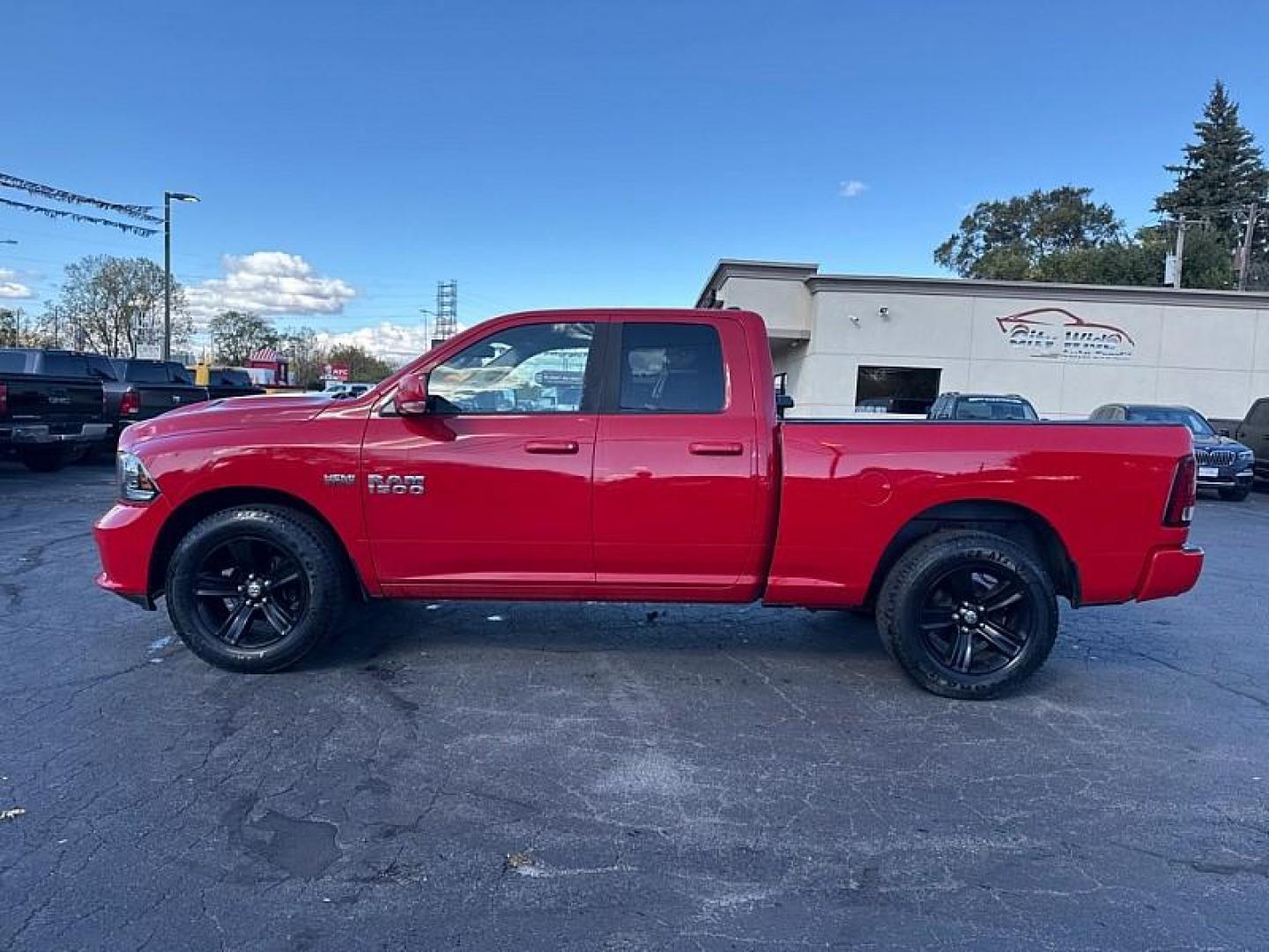 2015 RED /BLACK RAM 1500 Sport Quad Cab 4WD (1C6RR7HT0FS) with an 5.7L V8 OHV 16V engine, 6-Speed Automatic transmission, located at 3304 Woodville Road, Northwood, OH, 43619, (419) 210-8019, 41.612694, -83.480743 - Your #1 Destination for Auto Loans and mdash;No Matter Your Credit!At our dealership, we believe everyone deserves the opportunity to drive their dream car and mdash;whether you have good credit, bad credit, or no credit at all. With a wide selection of hundreds of cars, trucks, and SUVs, you'll fin - Photo#1