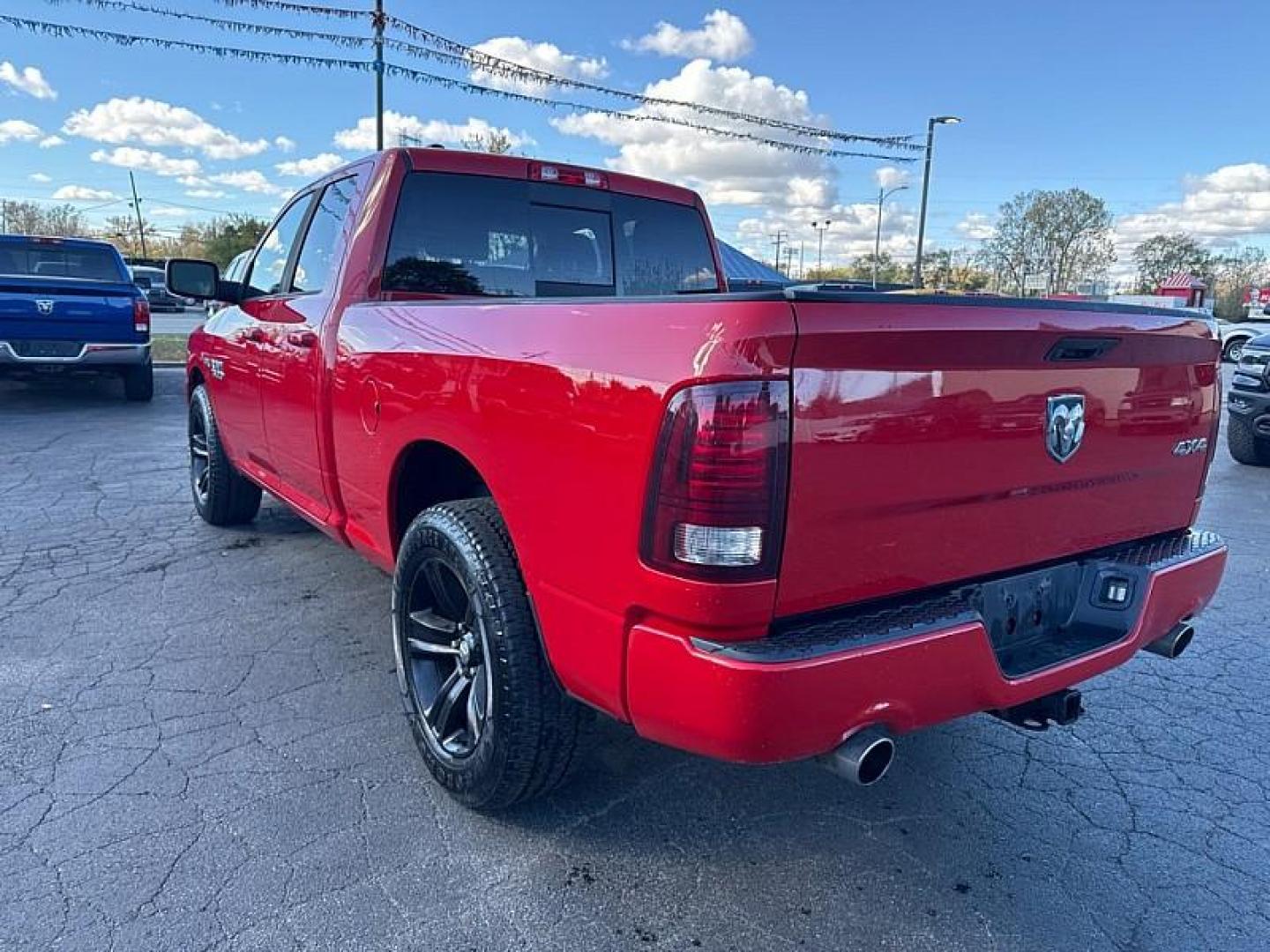 2015 RED /BLACK RAM 1500 Sport Quad Cab 4WD (1C6RR7HT0FS) with an 5.7L V8 OHV 16V engine, 6-Speed Automatic transmission, located at 3304 Woodville Road, Northwood, OH, 43619, (419) 210-8019, 41.612694, -83.480743 - Your #1 Destination for Auto Loans and mdash;No Matter Your Credit!At our dealership, we believe everyone deserves the opportunity to drive their dream car and mdash;whether you have good credit, bad credit, or no credit at all. With a wide selection of hundreds of cars, trucks, and SUVs, you'll fin - Photo#2