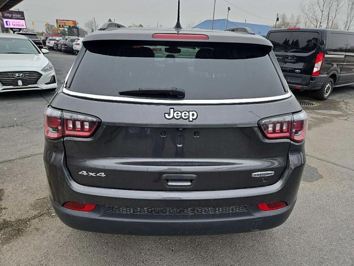 2020 GRAY /BLACK Jeep Compass Latitude 4WD (3C4NJDBB9LT) with an 2.4L L4 DOHC 16V engine, Automatic 9-Spd transmission, located at 3304 Woodville Road, Northwood, OH, 43619, (419) 210-8019, 41.612694, -83.480743 - Your #1 Destination for Auto Loans and mdash;No Matter Your Credit!At our dealership, we believe everyone deserves the opportunity to drive their dream car and mdash;whether you have good credit, bad credit, or no credit at all. With a wide selection of hundreds of cars, trucks, and SUVs, you'll fin - Photo#0