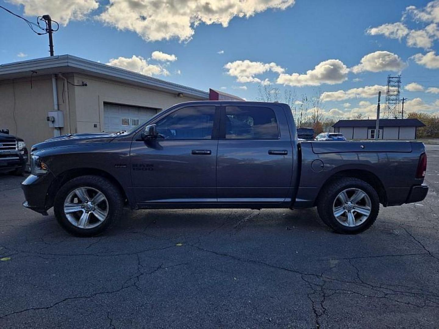 2015 GRAY /BLACK RAM 1500 Sport Crew Cab SWB 4WD (1C6RR7MT3FS) with an 5.7L V8 OHV 16V engine, 6-Speed Automatic transmission, located at 3304 Woodville Road, Northwood, OH, 43619, (419) 210-8019, 41.612694, -83.480743 - Your #1 Destination for Auto Loans and mdash;No Matter Your Credit!At our dealership, we believe everyone deserves the opportunity to drive their dream car and mdash;whether you have good credit, bad credit, or no credit at all. With a wide selection of hundreds of cars, trucks, and SUVs, you'll fin - Photo#1