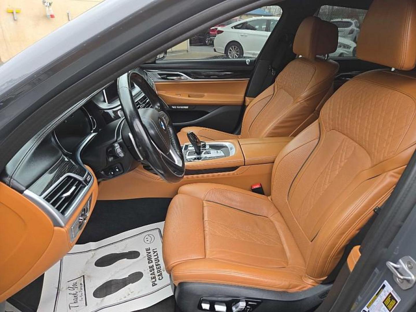 2018 GRAY BMW 7-Series 750i xDrive (WBA7F2C52JB) with an 4.4L V8 DOHC 32V engine, 8A transmission, located at 3304 Woodville Road, Northwood, OH, 43619, (419) 210-8019, 41.612694, -83.480743 - Your #1 Destination for Auto Loans and mdash;No Matter Your Credit!At our dealership, we believe everyone deserves the opportunity to drive their dream car and mdash;whether you have good credit, bad credit, or no credit at all. With a wide selection of hundreds of cars, trucks, and SUVs, you'll fin - Photo#9