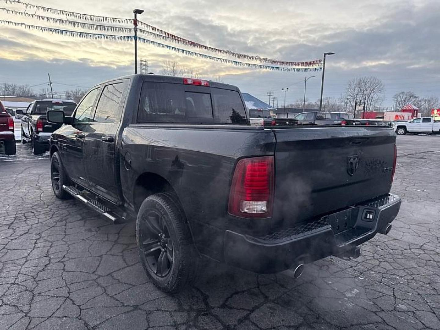 2017 BLACK /BLACK RAM 1500 Sport Crew Cab SWB 4WD (1C6RR7MT9HS) with an 5.7L V8 OHV 16V engine, 8A transmission, located at 3304 Woodville Road, Northwood, OH, 43619, (419) 210-8019, 41.612694, -83.480743 - Your #1 Destination for Auto Loans and mdash;No Matter Your Credit!At our dealership, we believe everyone deserves the opportunity to drive their dream car and mdash;whether you have good credit, bad credit, or no credit at all. With a wide selection of hundreds of cars, trucks, and SUVs, you'll fin - Photo#2