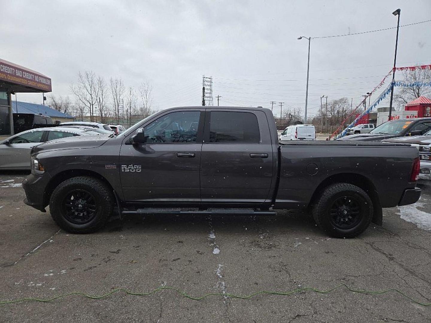 2014 GRAY RAM 1500 Sport Crew Cab LWB 4WD (1C6RR7UT2ES) with an 5.7L V8 OHV 16V engine, 6-Speed Automatic transmission, located at 3304 Woodville Road, Northwood, OH, 43619, (419) 210-8019, 41.612694, -83.480743 - Your #1 Destination for Auto Loans and mdash;No Matter Your Credit!At our dealership, we believe everyone deserves the opportunity to drive their dream car and mdash;whether you have good credit, bad credit, or no credit at all. With a wide selection of hundreds of cars, trucks, and SUVs, you'll fin - Photo#1