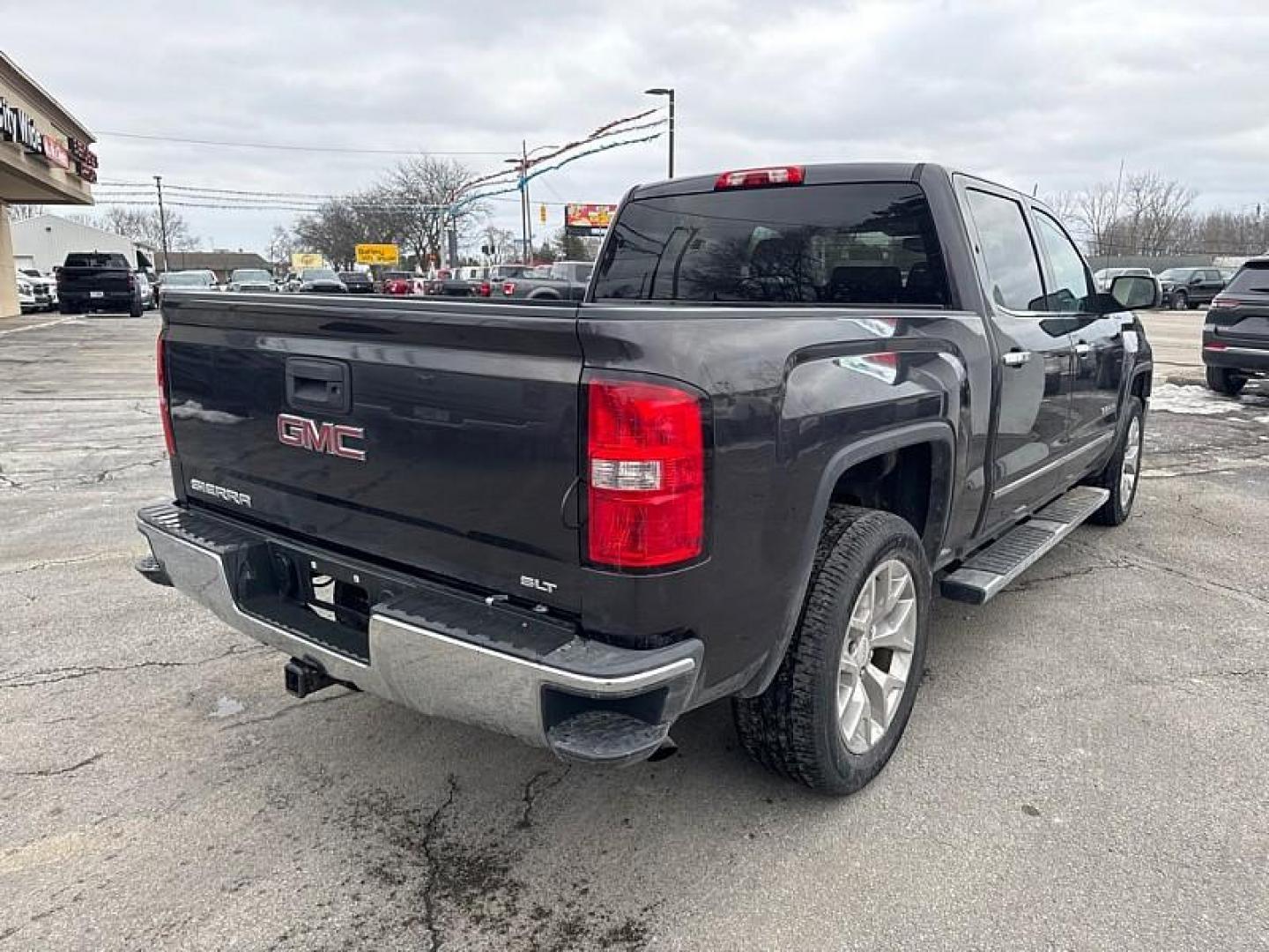 2015 GRAY GMC Sierra 1500 SLT Crew Cab Long Box 4WD (3GTU2VEC1FG) with an 5.3L V8 OHV 16V engine, 6-Speed Automatic transmission, located at 3304 Woodville Road, Northwood, OH, 43619, (419) 210-8019, 41.612694, -83.480743 - Your #1 Destination for Auto Loans and mdash;No Matter Your Credit!At our dealership, we believe everyone deserves the opportunity to drive their dream car and mdash;whether you have good credit, bad credit, or no credit at all. With a wide selection of hundreds of cars, trucks, and SUVs, you'll fin - Photo#4