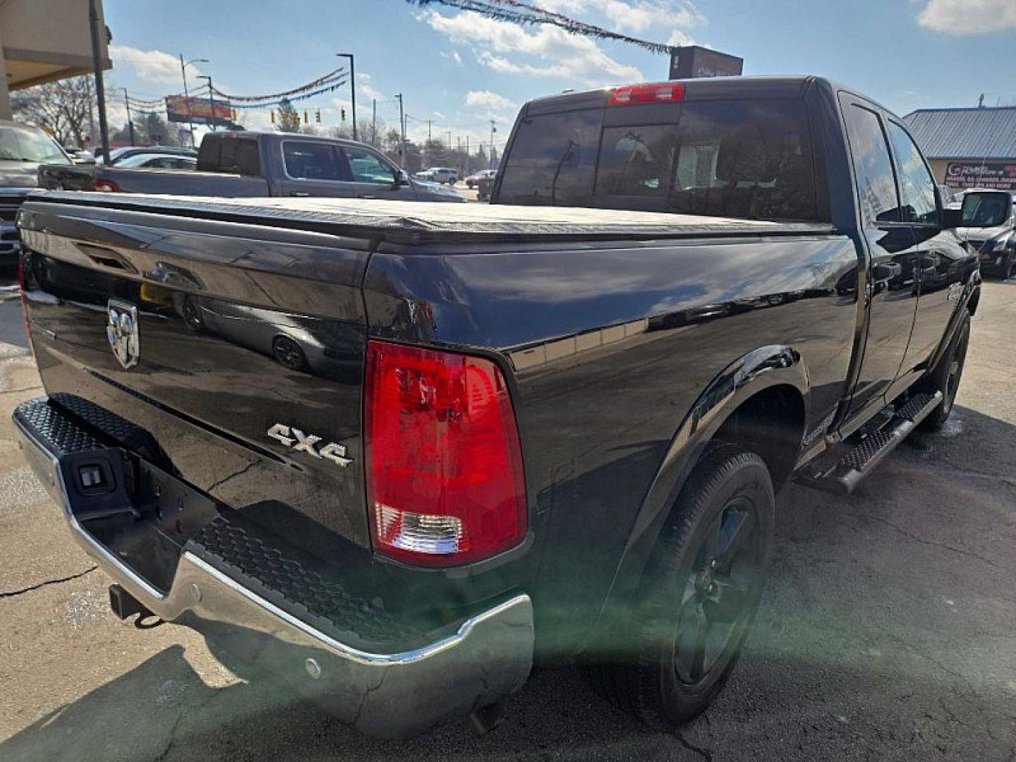 2017 BLACK /GRAY RAM 1500 SLT Quad Cab 4WD (1C6RR7GG1HS) with an 3.6L V6 DOHC 24V FFV engine, 8A transmission, located at 3304 Woodville Road, Northwood, OH, 43619, (419) 210-8019, 41.612694, -83.480743 - Your #1 Destination for Auto Loans and mdash;No Matter Your Credit!At our dealership, we believe everyone deserves the opportunity to drive their dream car and mdash;whether you have good credit, bad credit, or no credit at all. With a wide selection of hundreds of cars, trucks, and SUVs, you'll fin - Photo#4
