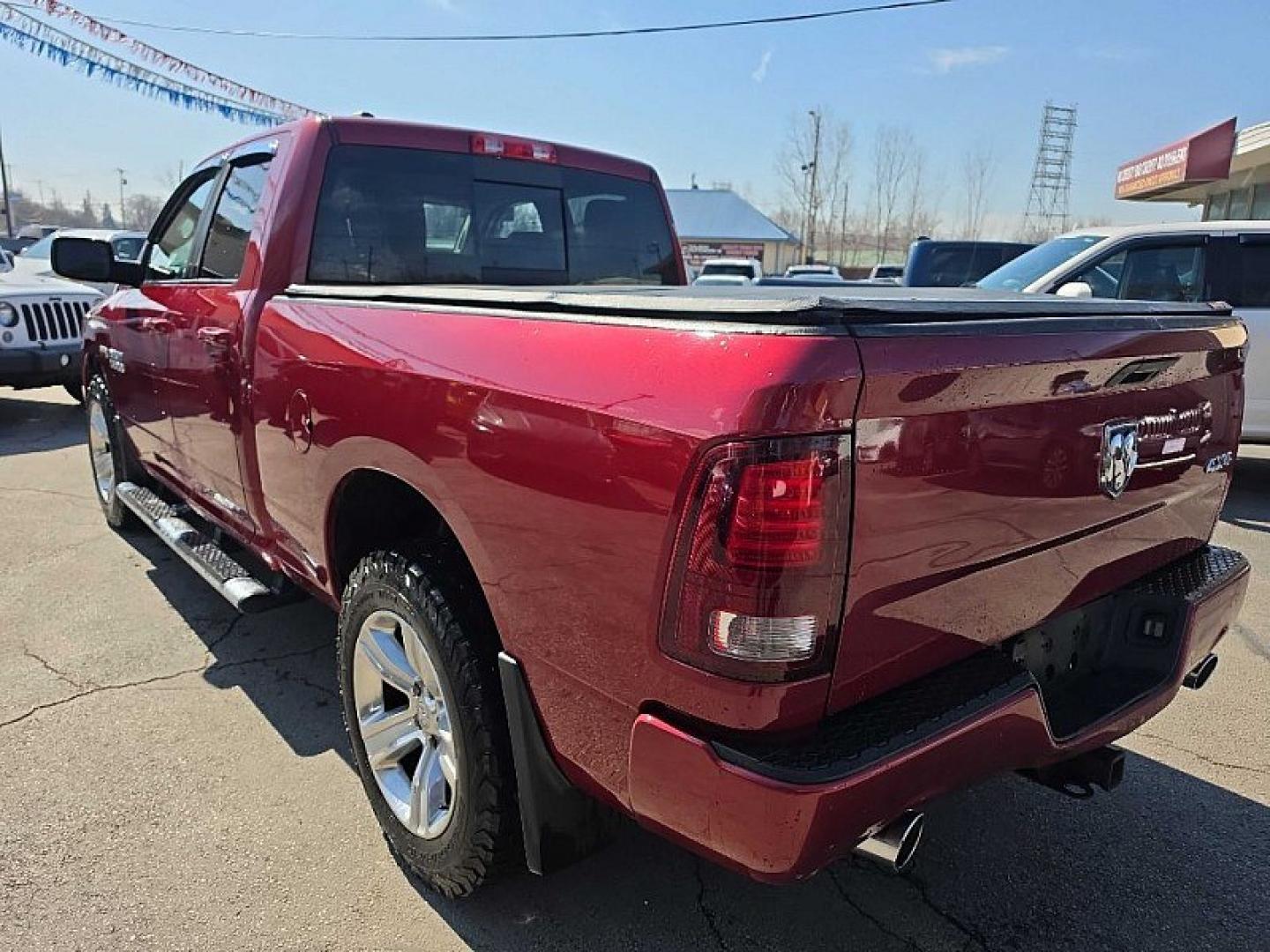 2014 RED /BLACK RAM 1500 Sport Quad Cab 4WD (1C6RR7HT3ES) with an 5.7L V8 OHV 16V engine, 6-Speed Automatic transmission, located at 3304 Woodville Road, Northwood, OH, 43619, (419) 210-8019, 41.612694, -83.480743 - Your #1 Destination for Auto Loans and mdash;No Matter Your Credit!At our dealership, we believe everyone deserves the opportunity to drive their dream car and mdash;whether you have good credit, bad credit, or no credit at all. With a wide selection of hundreds of cars, trucks, and SUVs, you'll fin - Photo#2