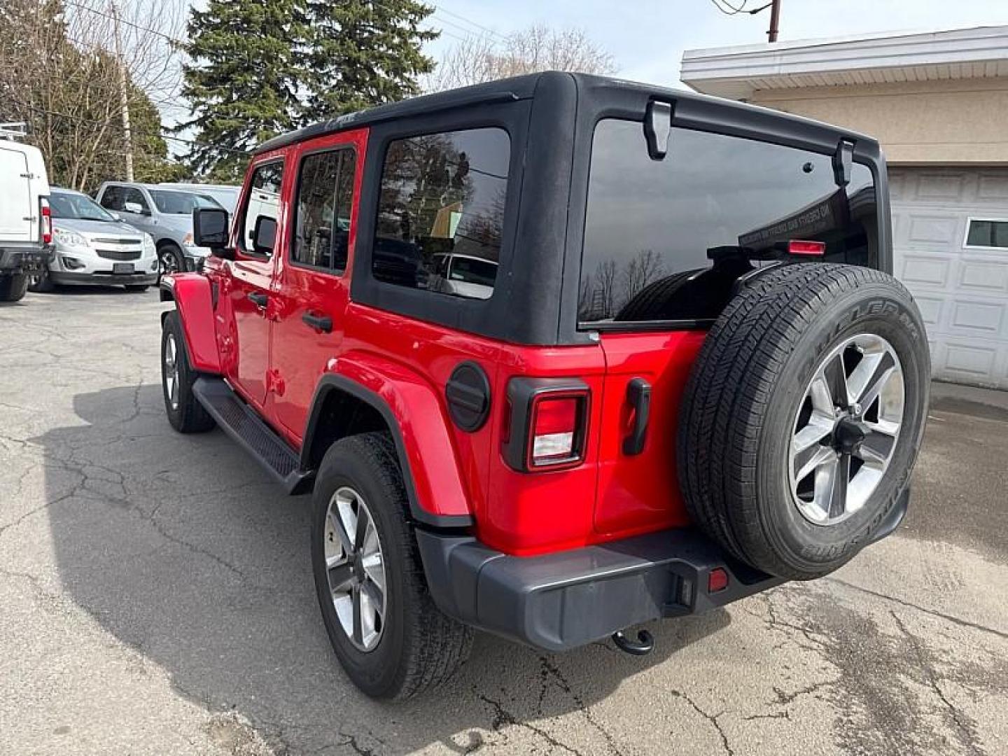 2020 RED /BLACK Jeep Wrangler Unlimited Sahara (1C4HJXEN7LW) with an 2.0L L4 DOHC 16V TURBO engine, 6A transmission, located at 3304 Woodville Road, Northwood, OH, 43619, (419) 210-8019, 41.612694, -83.480743 - Your #1 Destination for Auto Loans and mdash;No Matter Your Credit!At our dealership, we believe everyone deserves the opportunity to drive their dream car and mdash;whether you have good credit, bad credit, or no credit at all. With a wide selection of hundreds of cars, trucks, and SUVs, you'll fin - Photo#2