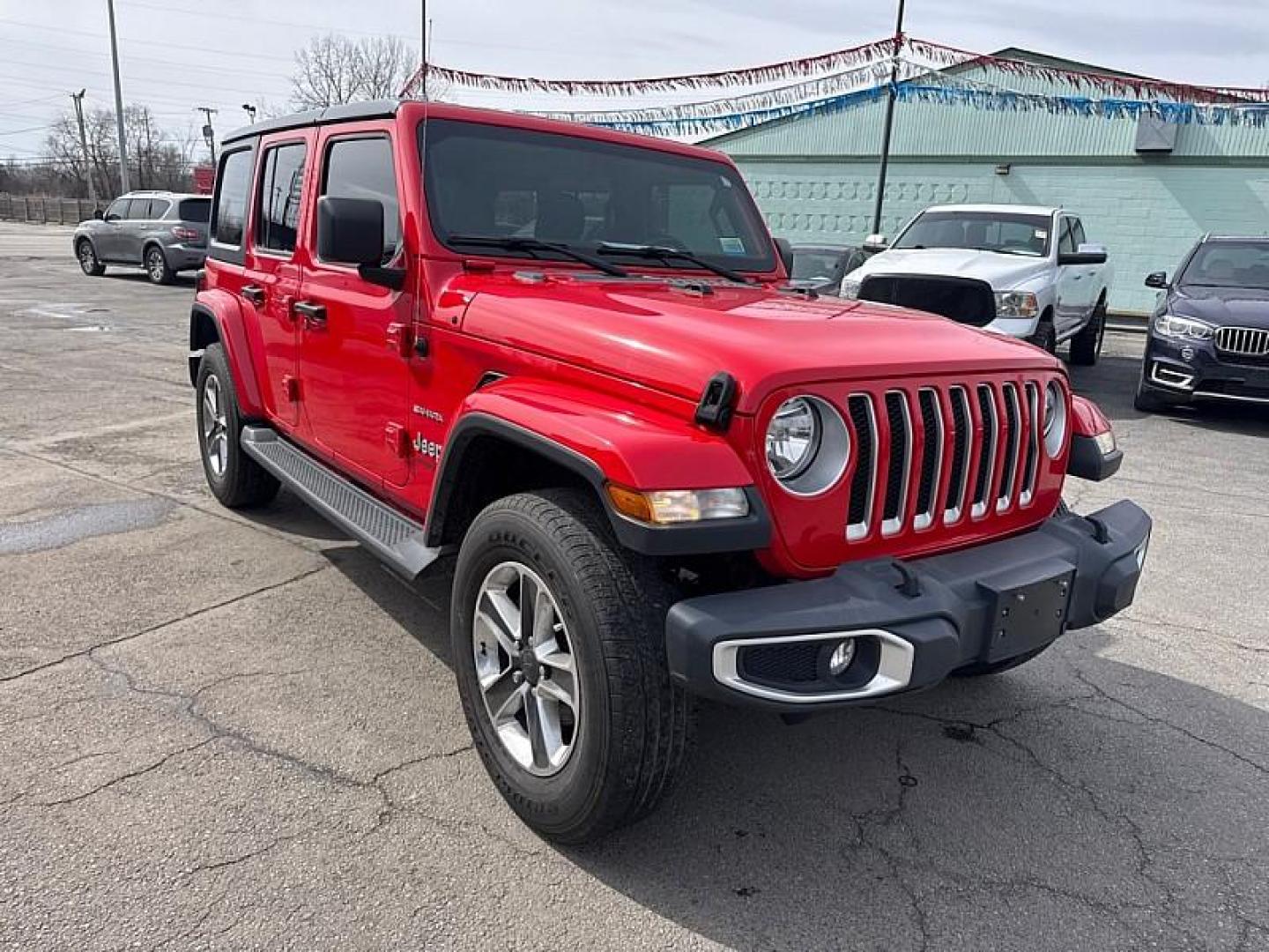 2020 RED /BLACK Jeep Wrangler Unlimited Sahara (1C4HJXEN7LW) with an 2.0L L4 DOHC 16V TURBO engine, 6A transmission, located at 3304 Woodville Road, Northwood, OH, 43619, (419) 210-8019, 41.612694, -83.480743 - Your #1 Destination for Auto Loans and mdash;No Matter Your Credit!At our dealership, we believe everyone deserves the opportunity to drive their dream car and mdash;whether you have good credit, bad credit, or no credit at all. With a wide selection of hundreds of cars, trucks, and SUVs, you'll fin - Photo#6