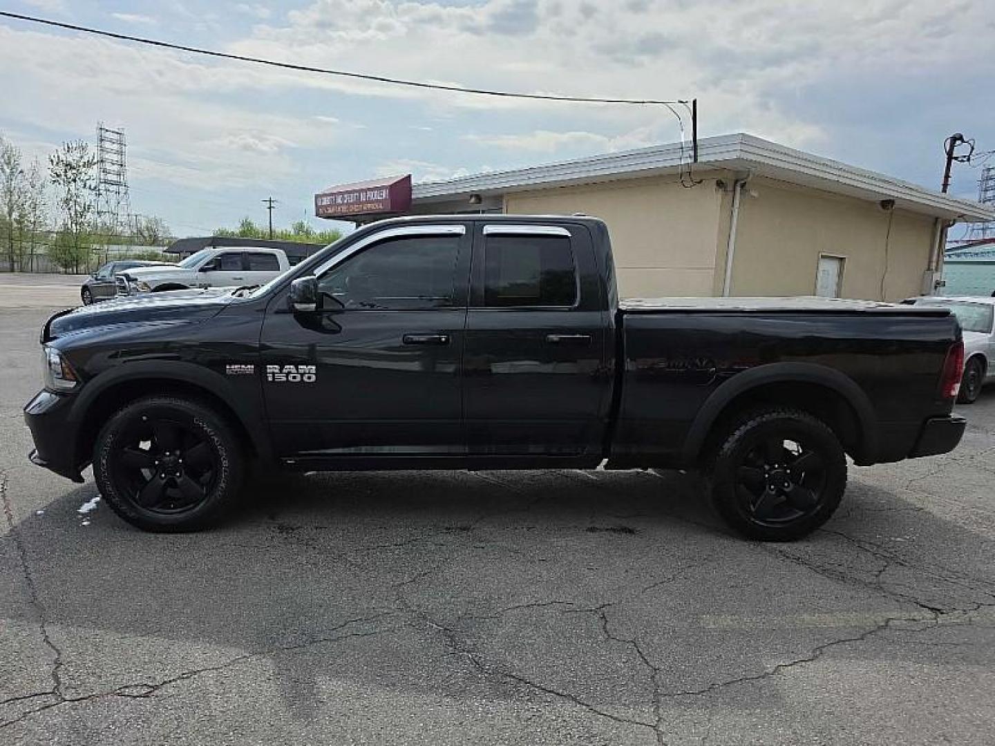 2016 BLACK /BLACK RAM 1500 Sport Quad Cab 4WD (1C6RR7HT0GS) with an 5.7L V8 OHV 16V engine, 6A transmission, located at 3304 Woodville Road, Northwood, OH, 43619, (419) 210-8019, 41.612694, -83.480743 - Your #1 Destination for Auto Loans and mdash;No Matter Your Credit!At our dealership, we believe everyone deserves the opportunity to drive their dream car and mdash;whether you have good credit, bad credit, or no credit at all. With a wide selection of hundreds of cars, trucks, and SUVs, you'll fin - Photo#1