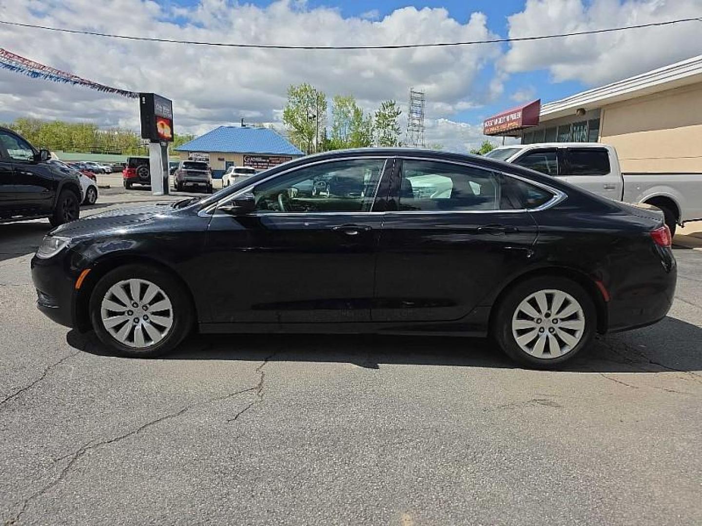 2016 BLACK /BLACK Chrysler 200 LX (1C3CCCFB8GN) with an 2.4L L4 DOHC 16V engine, 9A transmission, located at 3304 Woodville Road, Northwood, OH, 43619, (419) 210-8019, 41.612694, -83.480743 - Your #1 Destination for Auto Loans and mdash;No Matter Your Credit!At our dealership, we believe everyone deserves the opportunity to drive their dream car and mdash;whether you have good credit, bad credit, or no credit at all. With a wide selection of hundreds of cars, trucks, and SUVs, you'll fin - Photo#2