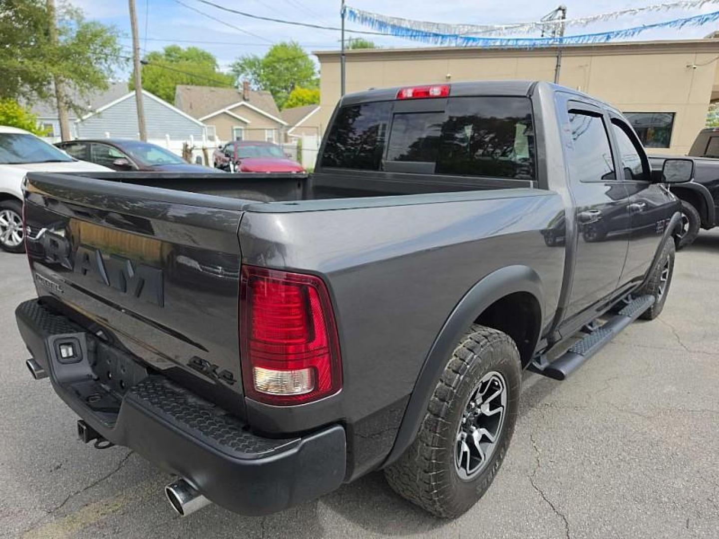 2017 GRAY /BLACK RAM 1500 Rebel Crew Cab SWB 4WD (1C6RR7YT4HS) with an 5.7L V8 OHV 16V engine, 8A transmission, located at 3304 Woodville Road, Northwood, OH, 43619, (419) 210-8019, 41.612694, -83.480743 - Your #1 Destination for Auto Loans and mdash;No Matter Your Credit!At our dealership, we believe everyone deserves the opportunity to drive their dream car and mdash;whether you have good credit, bad credit, or no credit at all. With a wide selection of hundreds of cars, trucks, and SUVs, you'll fin - Photo#4
