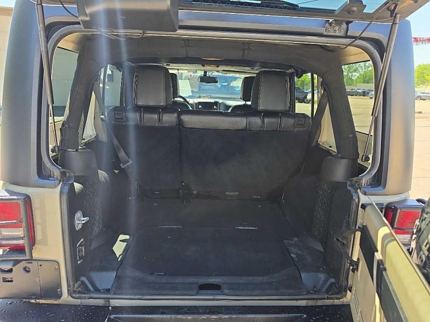 2018 TAN /BLACK/TAN Jeep Wrangler Unlimited Sport 4WD (1C4BJWDG5JL) with an 3.6L V6 DOHC 24V FFV engine, Automatic 5-Spd transmission, located at 3304 Woodville Road, Northwood, OH, 43619, (419) 210-8019, 41.612694, -83.480743 - Your #1 Destination for Auto Loans and mdash;No Matter Your Credit!At our dealership, we believe everyone deserves the opportunity to drive their dream car and mdash;whether you have good credit, bad credit, or no credit at all. With a wide selection of hundreds of cars, trucks, and SUVs, you'll fin - Photo#13