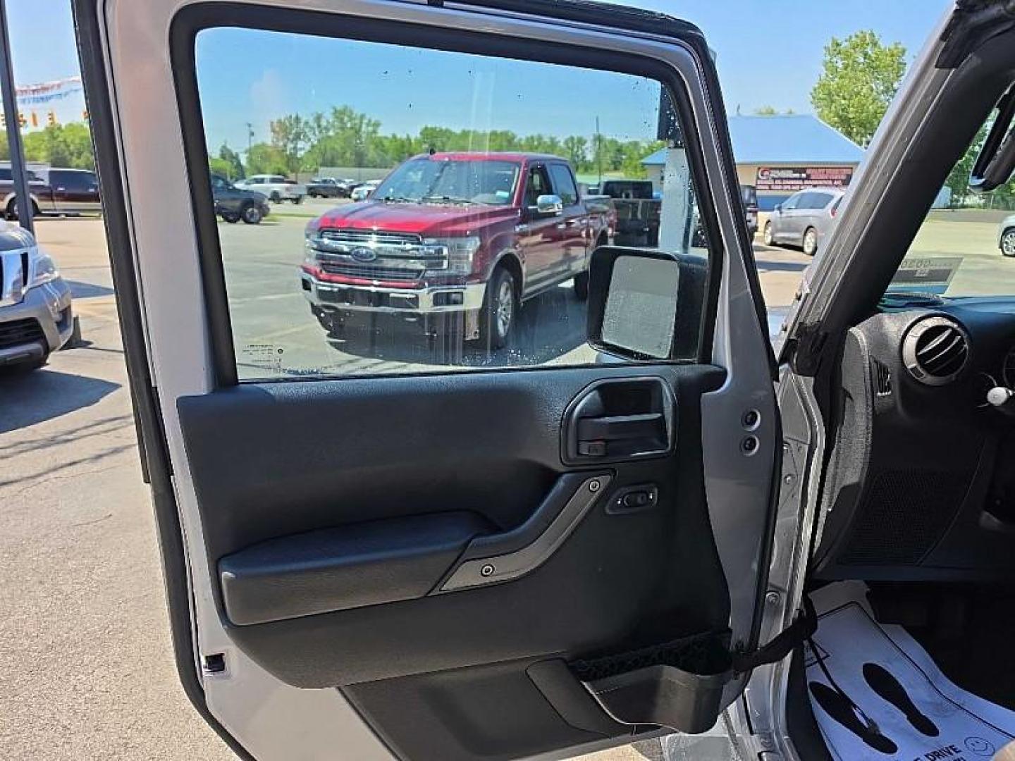 2016 SILVER /BLACK Jeep Wrangler Unlimited Sport 4WD (1C4BJWDG7GL) with an 3.6L V6 DOHC 24V FFV engine, Automatic 5-Spd transmission, located at 3304 Woodville Road, Northwood, OH, 43619, (419) 210-8019, 41.612694, -83.480743 - Your #1 Destination for Auto Loans and mdash;No Matter Your Credit!At our dealership, we believe everyone deserves the opportunity to drive their dream car and mdash;whether you have good credit, bad credit, or no credit at all. With a wide selection of hundreds of cars, trucks, and SUVs, you'll fin - Photo#8