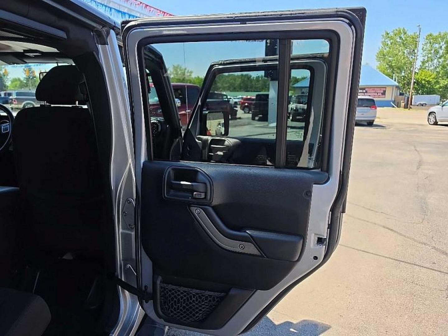 2016 SILVER /BLACK Jeep Wrangler Unlimited Sport 4WD (1C4BJWDG7GL) with an 3.6L V6 DOHC 24V FFV engine, Automatic 5-Spd transmission, located at 3304 Woodville Road, Northwood, OH, 43619, (419) 210-8019, 41.612694, -83.480743 - Your #1 Destination for Auto Loans and mdash;No Matter Your Credit!At our dealership, we believe everyone deserves the opportunity to drive their dream car and mdash;whether you have good credit, bad credit, or no credit at all. With a wide selection of hundreds of cars, trucks, and SUVs, you'll fin - Photo#27