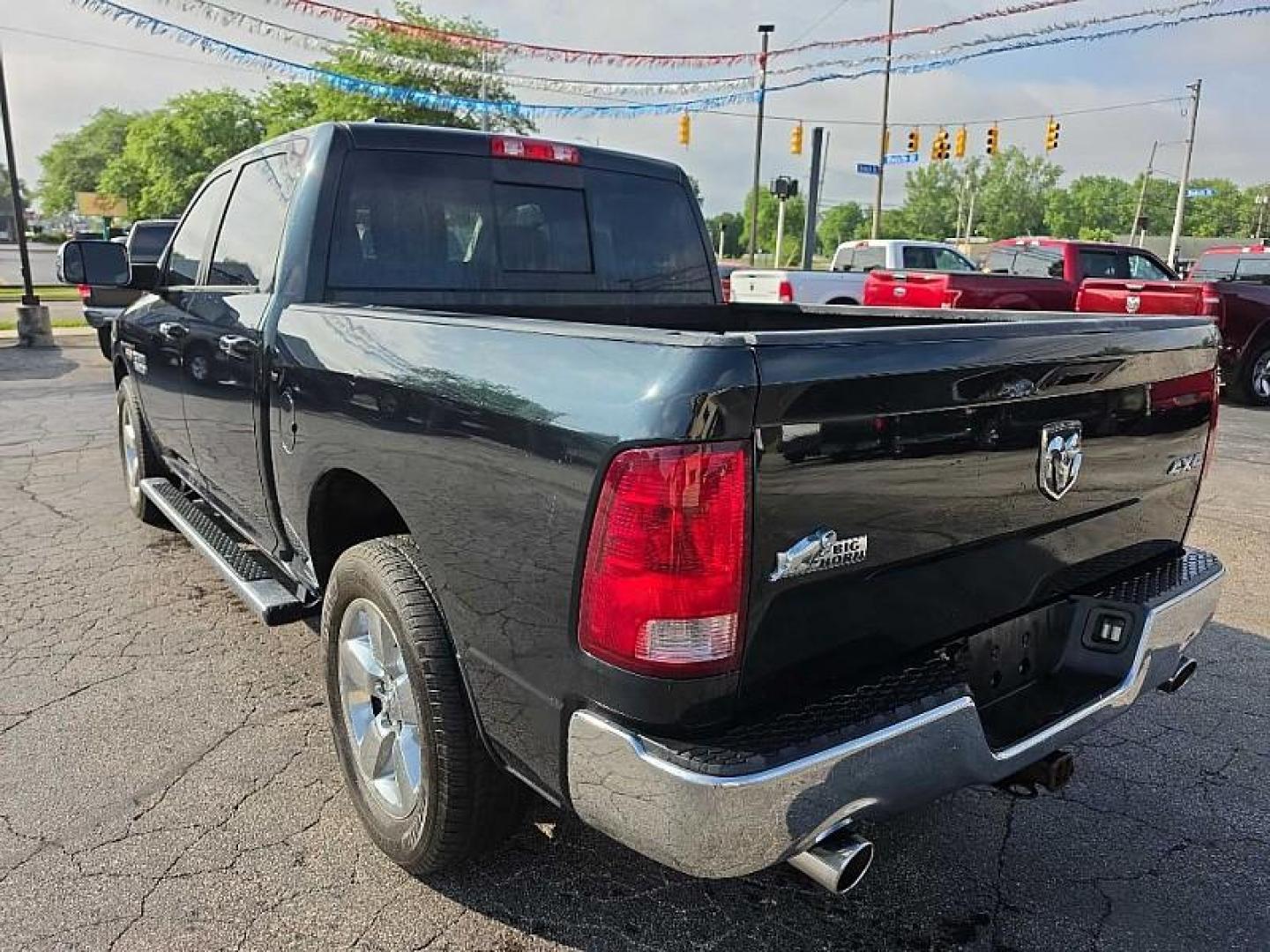 2017 GREEN /BLACK RAM 1500 SLT Crew Cab SWB 4WD (1C6RR7LT4HS) with an 5.7L V8 OHV 16V engine, 8A transmission, located at 3304 Woodville Road, Northwood, OH, 43619, (419) 210-8019, 41.612694, -83.480743 - Your #1 Destination for Auto Loans and mdash;No Matter Your Credit!At our dealership, we believe everyone deserves the opportunity to drive their dream car and mdash;whether you have good credit, bad credit, or no credit at all. With a wide selection of hundreds of cars, trucks, and SUVs, you'll fin - Photo#2