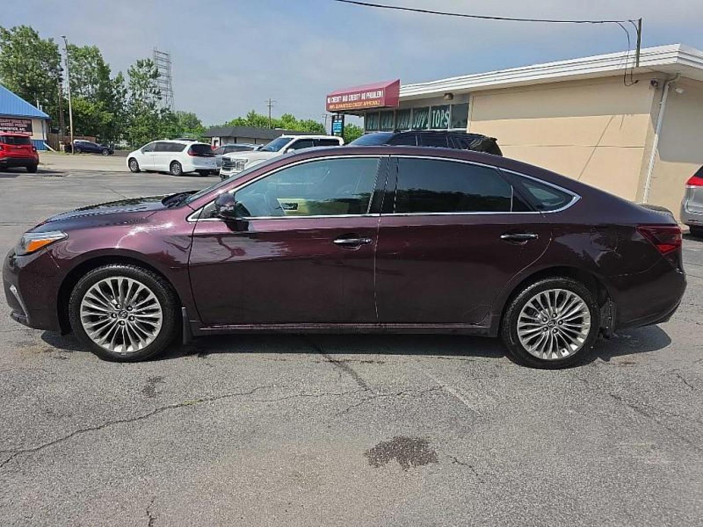 2017 MAROON /TAN Toyota Avalon XLE (4T1BK1EB4HU) with an 3.5L V6 DOHC 24V engine, 6A transmission, located at 3304 Woodville Road, Northwood, OH, 43619, (419) 210-8019, 41.612694, -83.480743 - Your #1 Destination for Auto Loans and mdash;No Matter Your Credit!At our dealership, we believe everyone deserves the opportunity to drive their dream car and mdash;whether you have good credit, bad credit, or no credit at all. With a wide selection of hundreds of cars, trucks, and SUVs, you'll fin - Photo#1