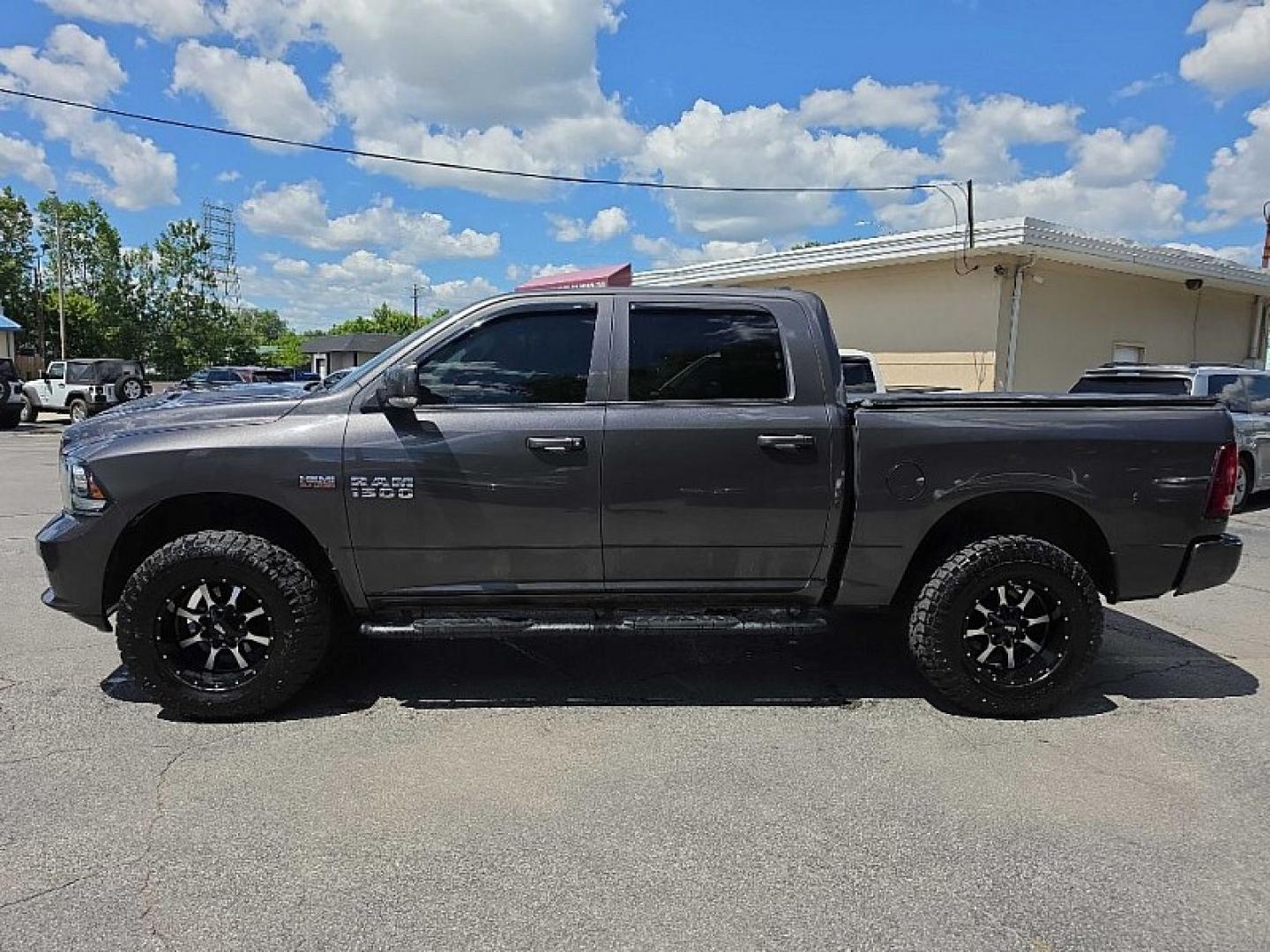 2016 GRAY /BLACK RAM 1500 Sport Crew Cab SWB 4WD (1C6RR7MT8GS) with an 5.7L V8 OHV 16V engine, 6A transmission, located at 3304 Woodville Road, Northwood, OH, 43619, (419) 210-8019, 41.612694, -83.480743 - Your #1 Destination for Auto Loans and mdash;No Matter Your Credit!At our dealership, we believe everyone deserves the opportunity to drive their dream car and mdash;whether you have good credit, bad credit, or no credit at all. With a wide selection of hundreds of cars, trucks, and SUVs, you'll fin- Photo#3