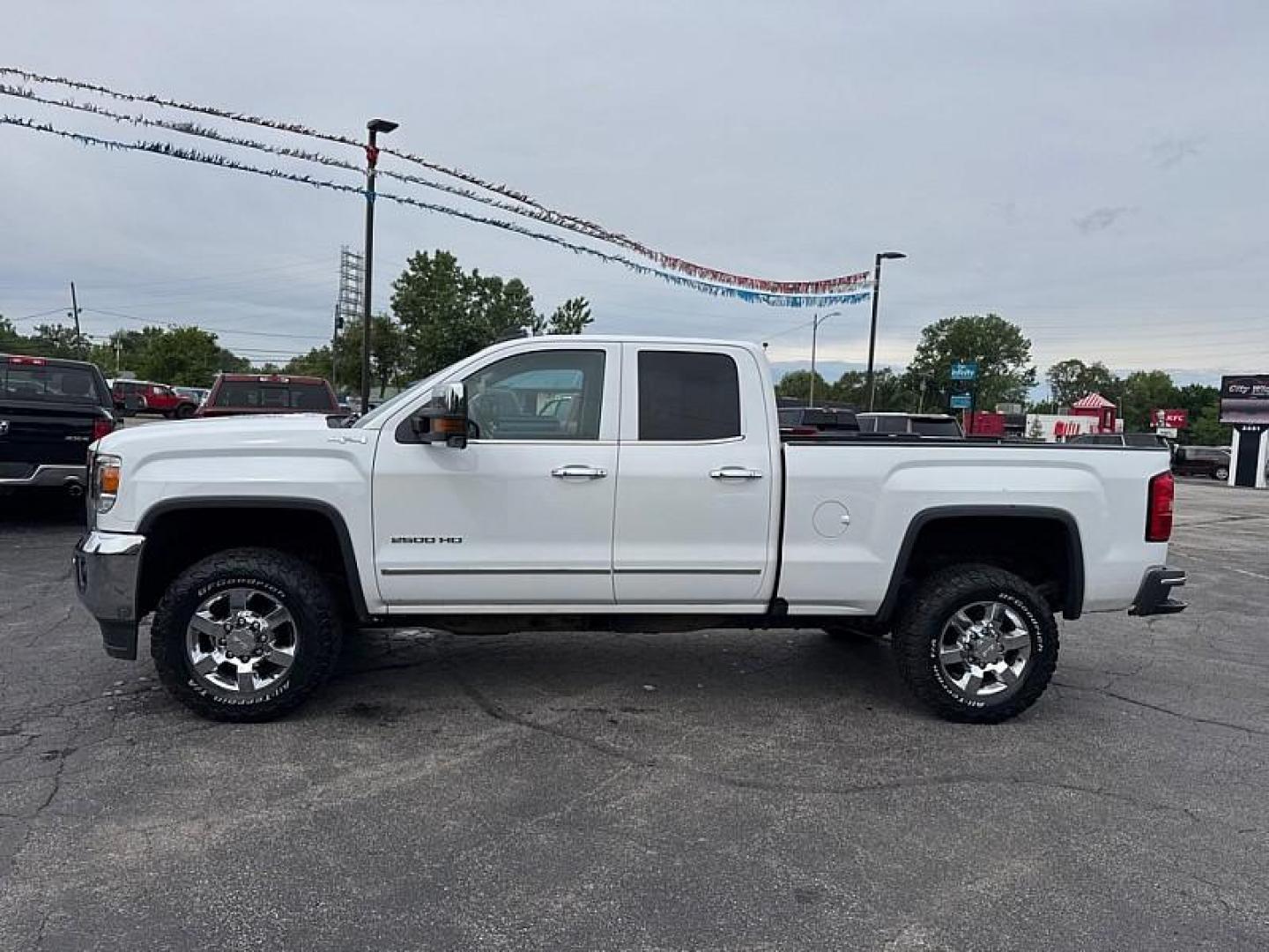 2016 WHITE /BROWN/TAN GMC Sierra 2500HD SLT Double Cab 4WD (1GT22TE86GZ) with an 6.6L V8 OHV 16V DIESEL engine, 6A transmission, located at 3304 Woodville Road, Northwood, OH, 43619, (419) 210-8019, 41.612694, -83.480743 - Your #1 Destination for Auto Loans and mdash;No Matter Your Credit!At our dealership, we believe everyone deserves the opportunity to drive their dream car and mdash;whether you have good credit, bad credit, or no credit at all. With a wide selection of hundreds of cars, trucks, and SUVs, you'll fin- Photo#1